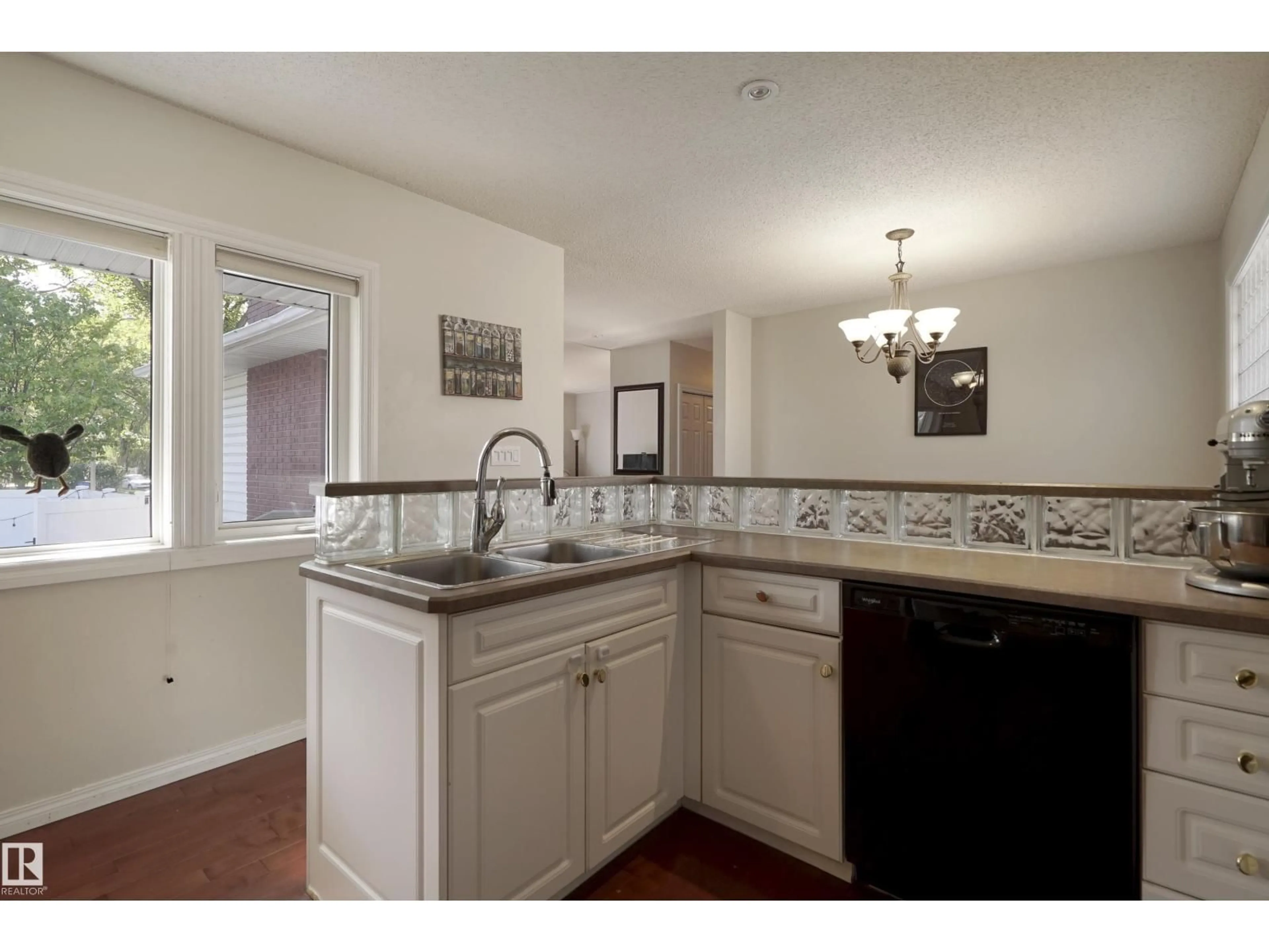 Open concept kitchen, ceramic/tile floor for 7804 92 AV, Edmonton Alberta T6C1R5