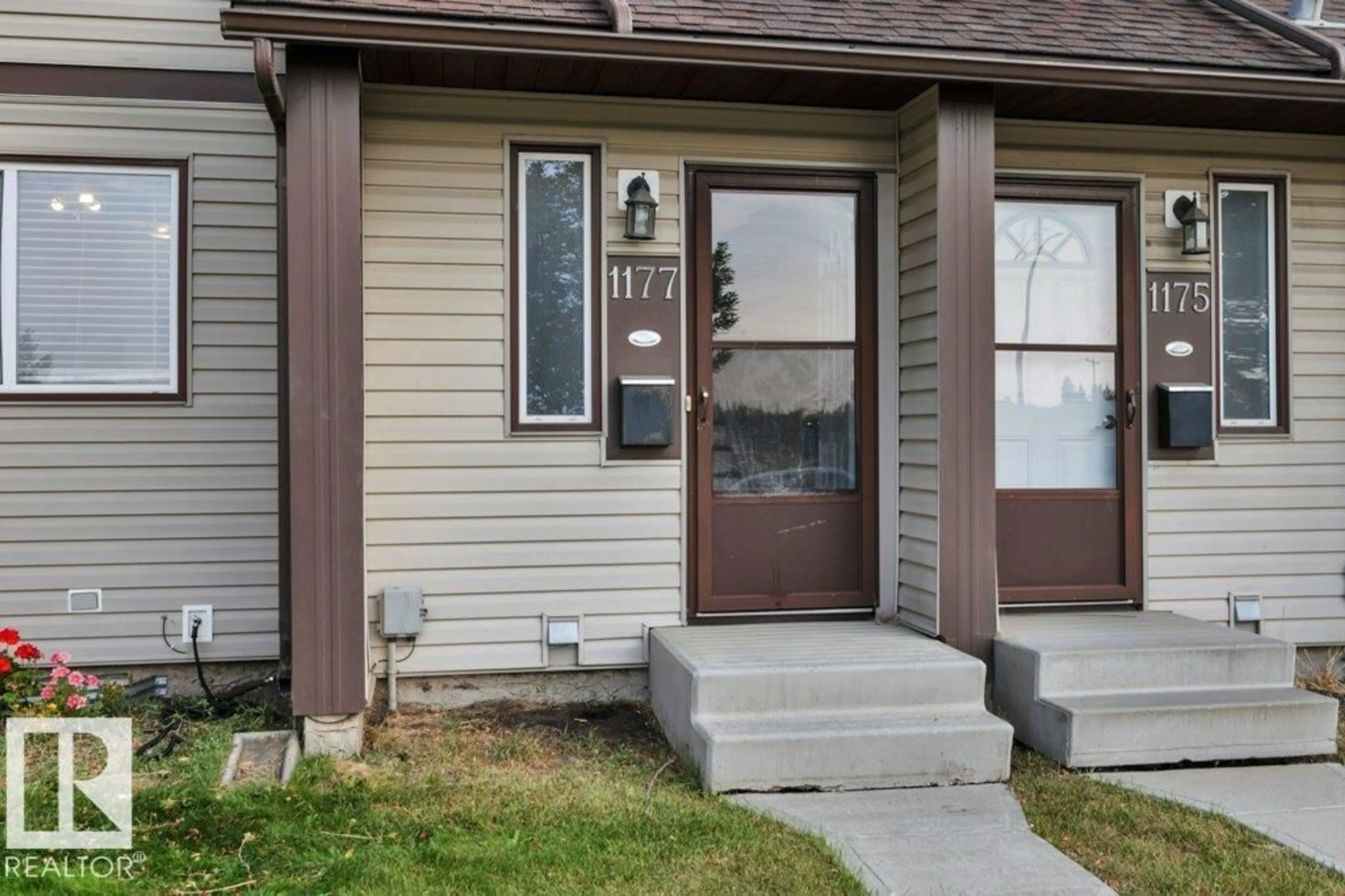 Home with vinyl exterior material, street for 1177 HOOKE RD, Edmonton Alberta T5A4A5