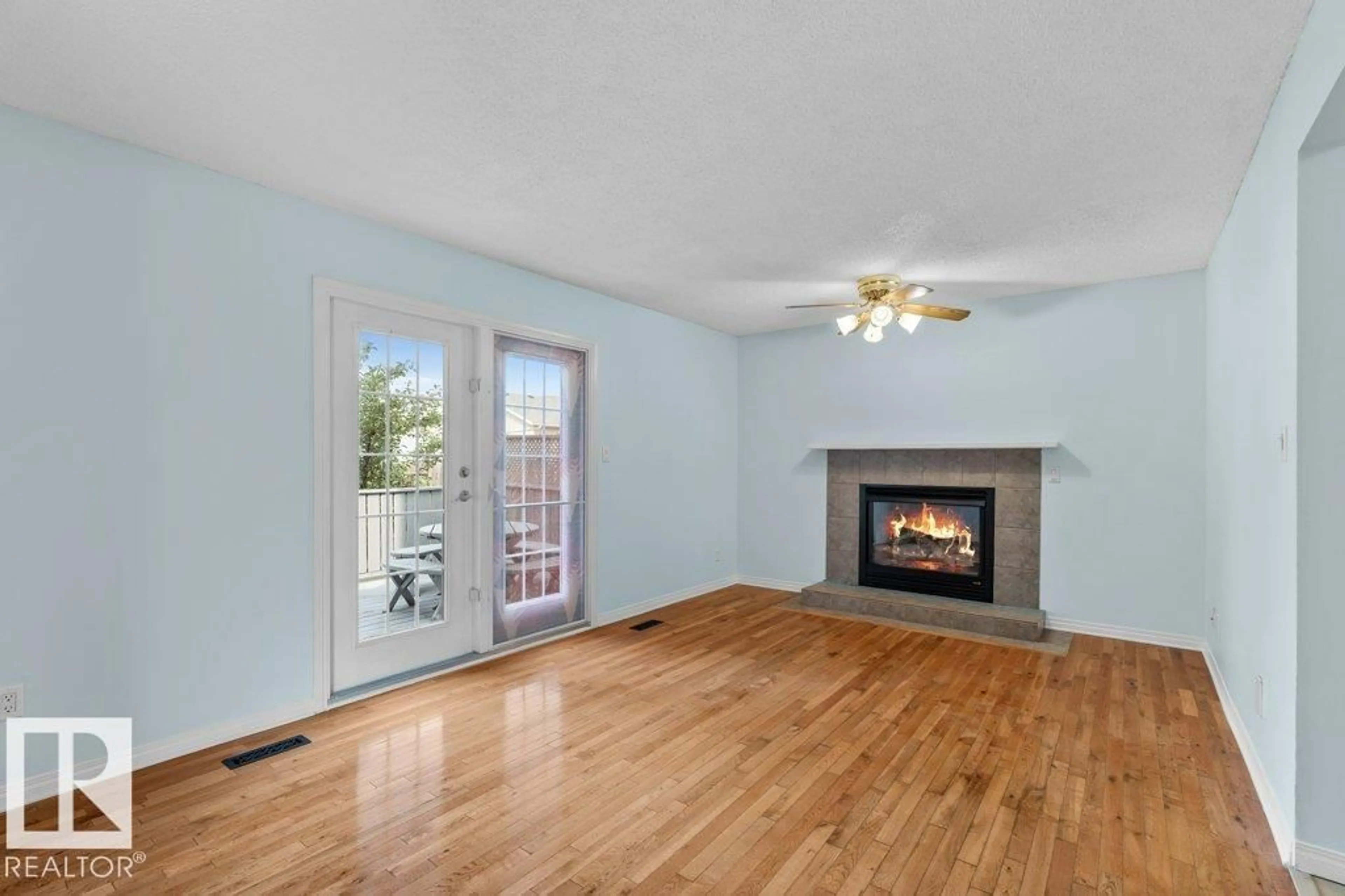Living room with furniture, wood/laminate floor for NW - 14524 31A ST, Edmonton Alberta T5Y2H7