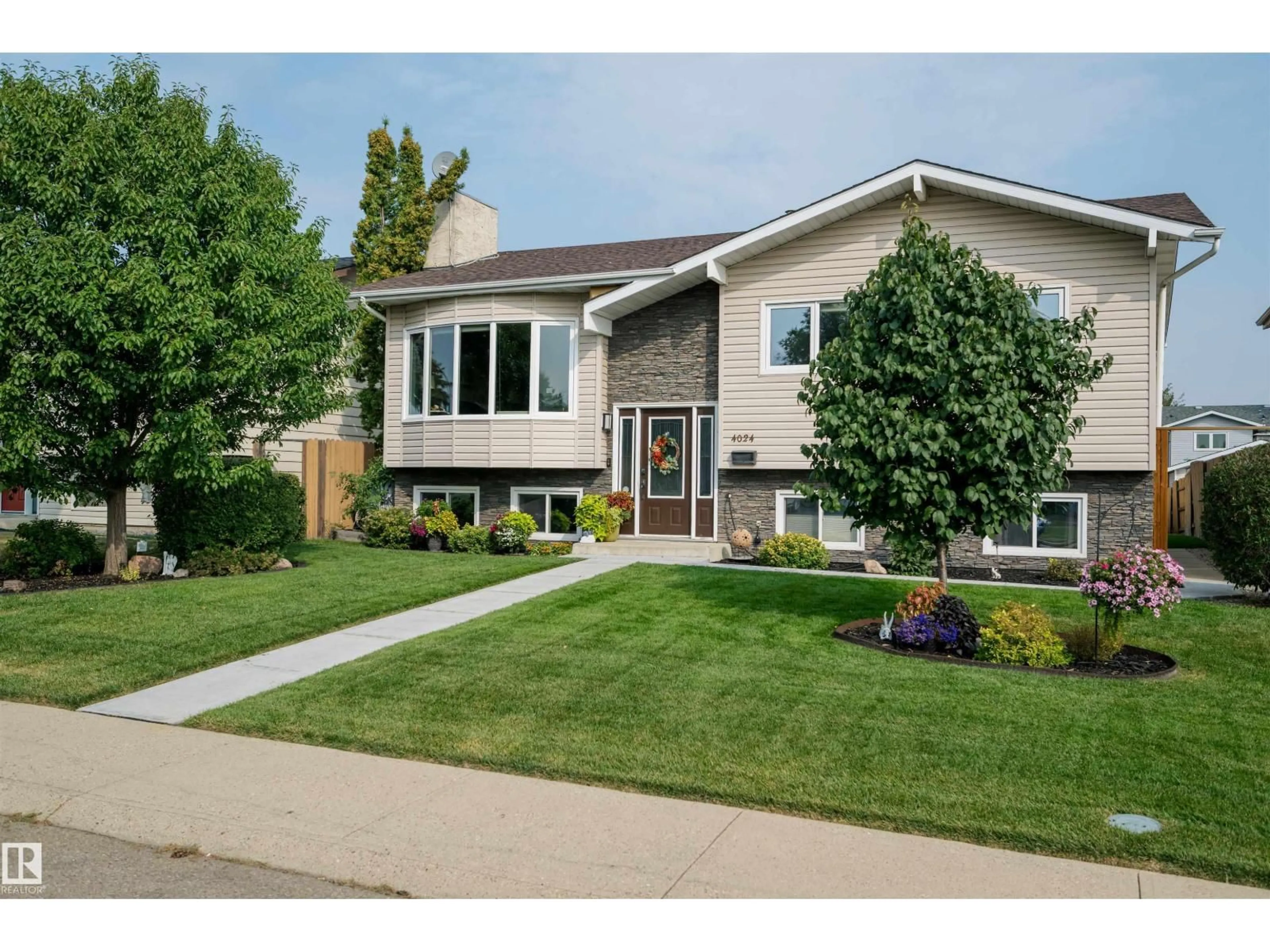 Home with vinyl exterior material, street for 4024 19 AV, Edmonton Alberta T6L3M7