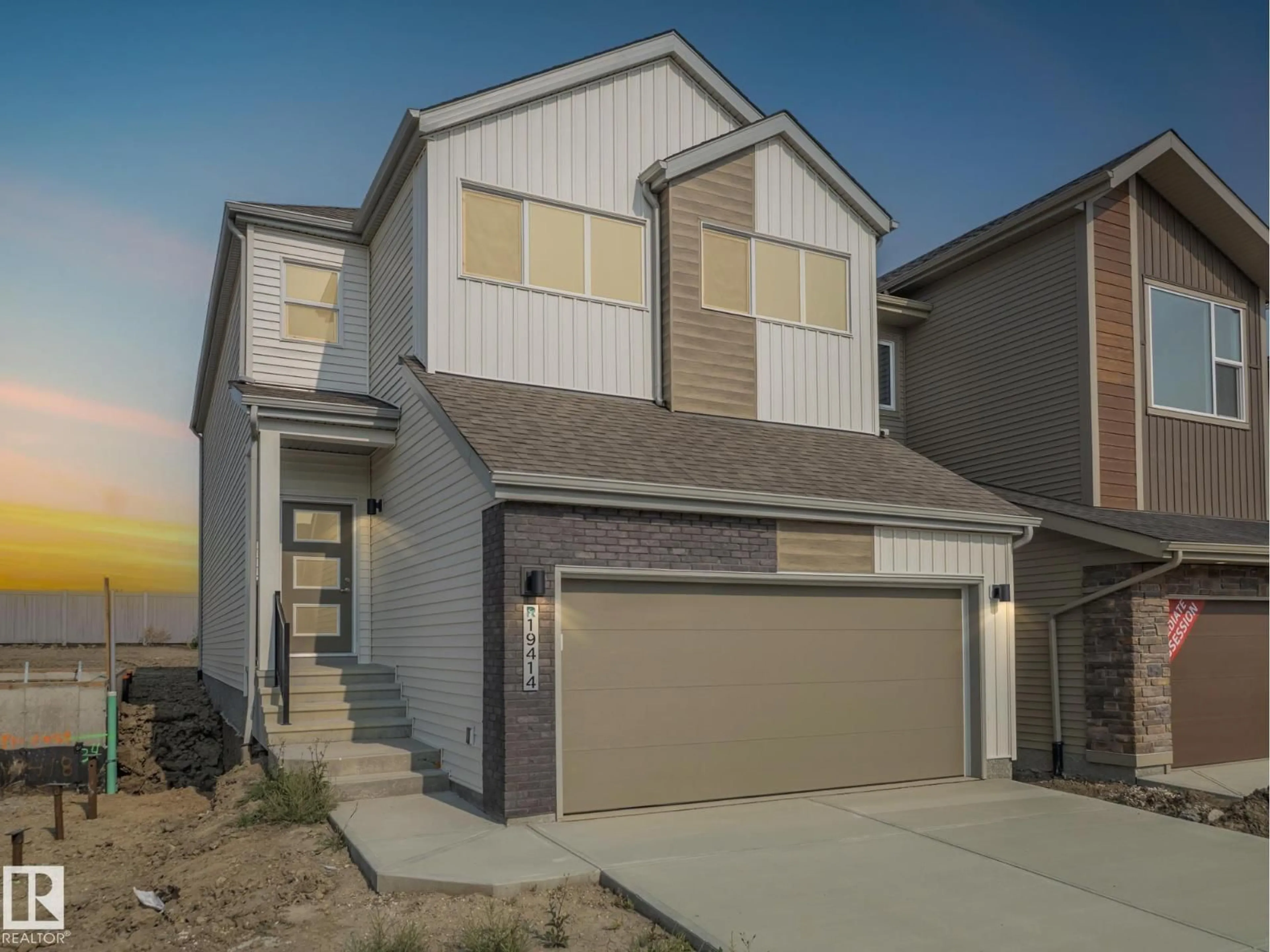 Home with vinyl exterior material, street for 19414 22A AV, Edmonton Alberta T6M3J2