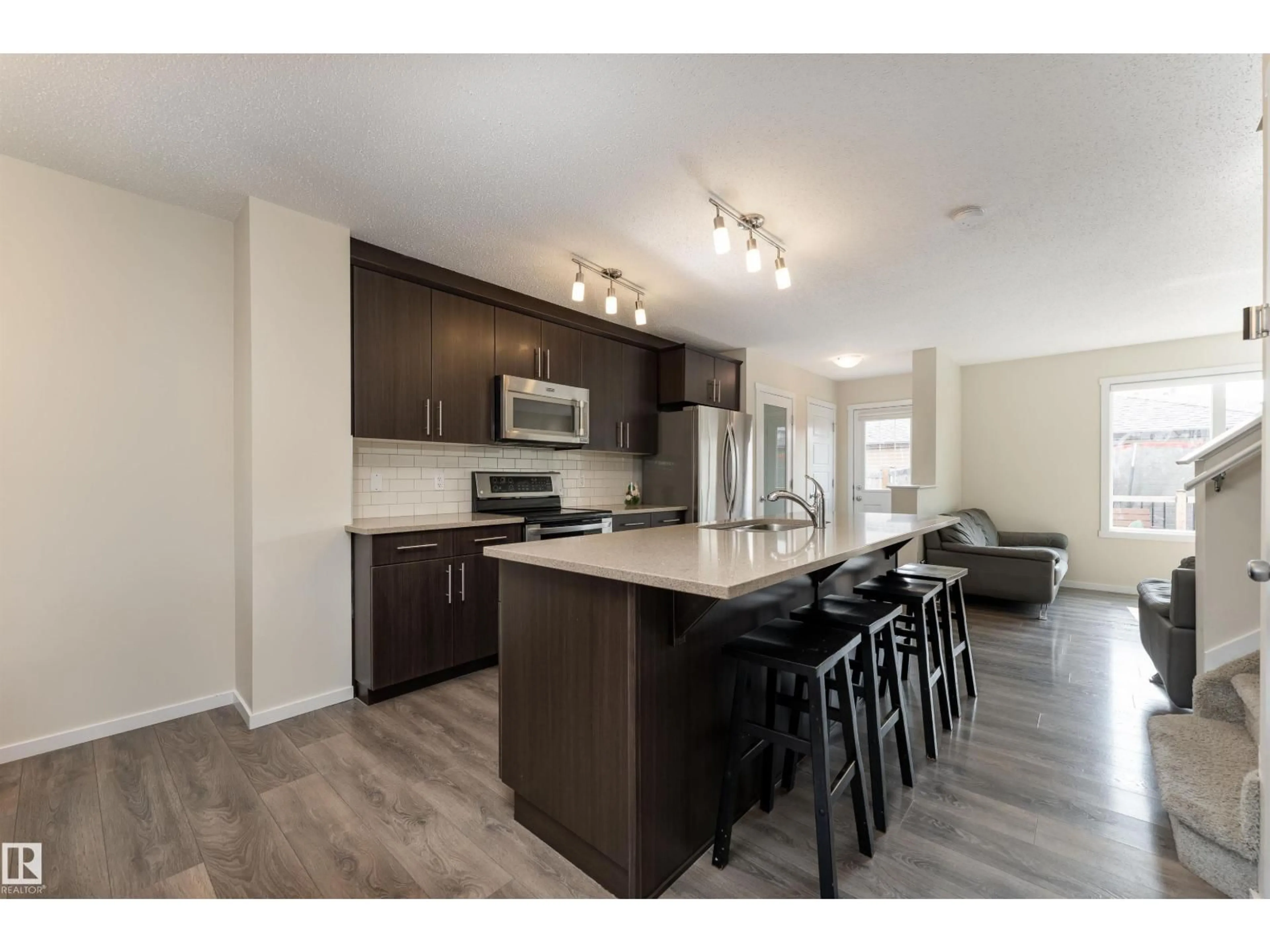 Open concept kitchen, wood/laminate floor for 517 CRYSTALLINA NERA DR, Edmonton Alberta T5Z0P6
