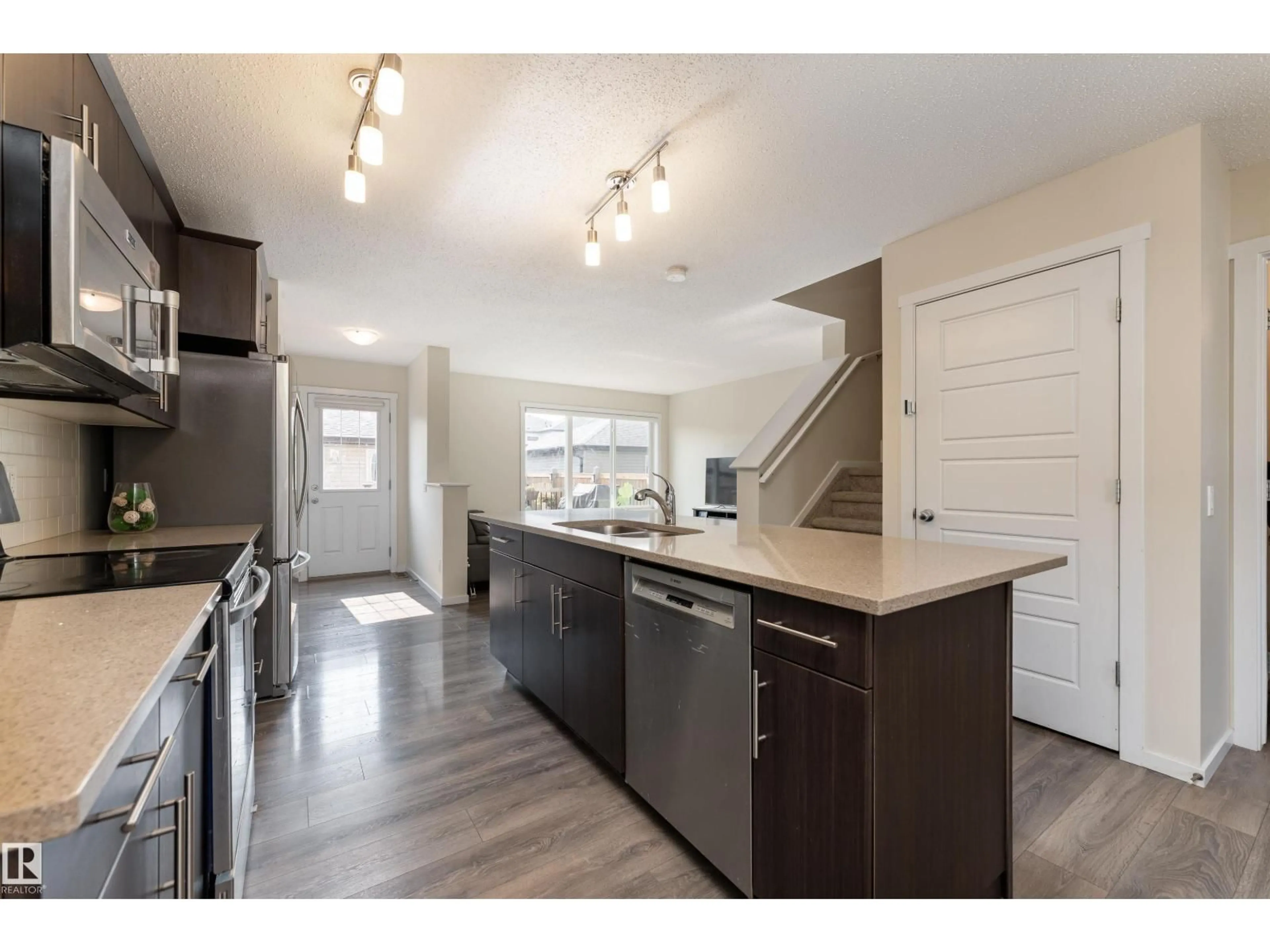 Open concept kitchen, wood/laminate floor for 517 CRYSTALLINA NERA DR, Edmonton Alberta T5Z0P6