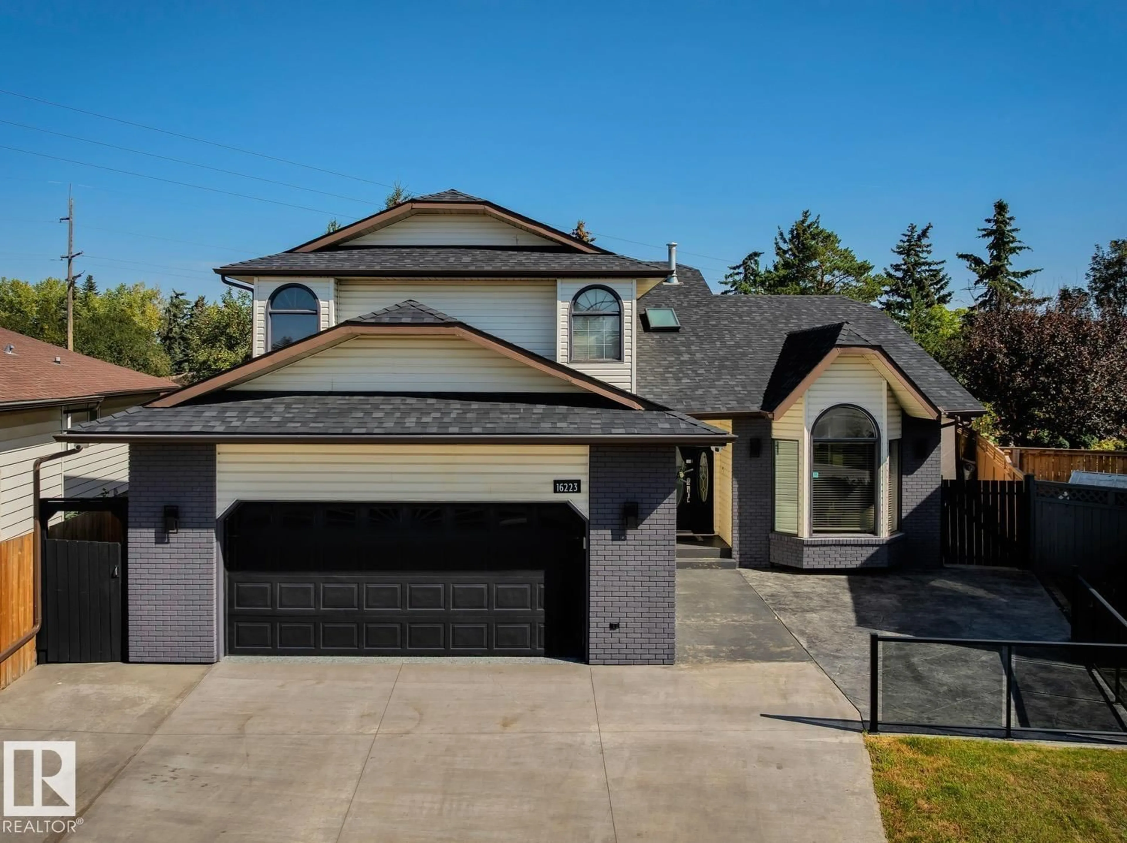Home with vinyl exterior material, street for 16223 98 ST, Edmonton Alberta T5X4Y6