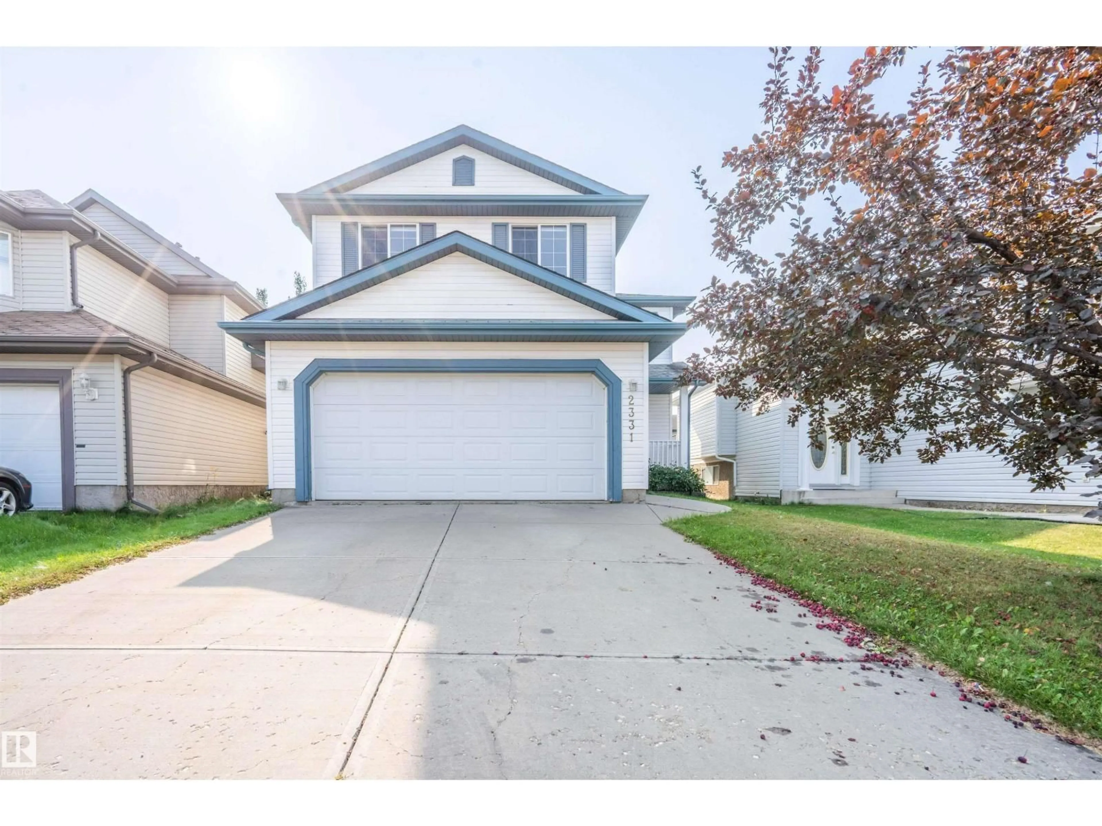 Home with vinyl exterior material, street for 2331 37B AV, Edmonton Alberta T6T1N9