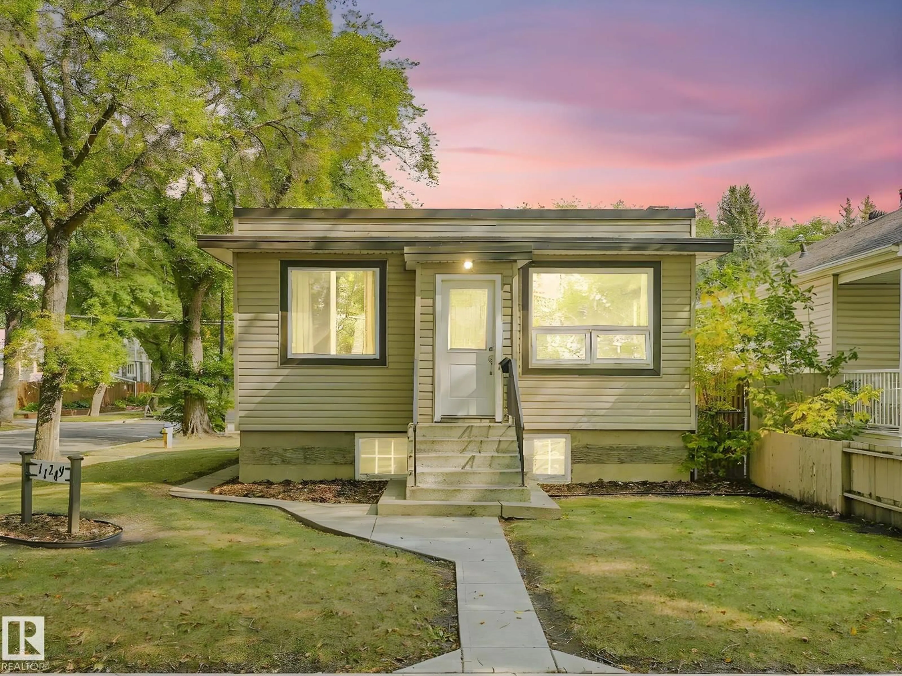 Home with vinyl exterior material, street for 11249 70 ST, Edmonton Alberta T5B1T1