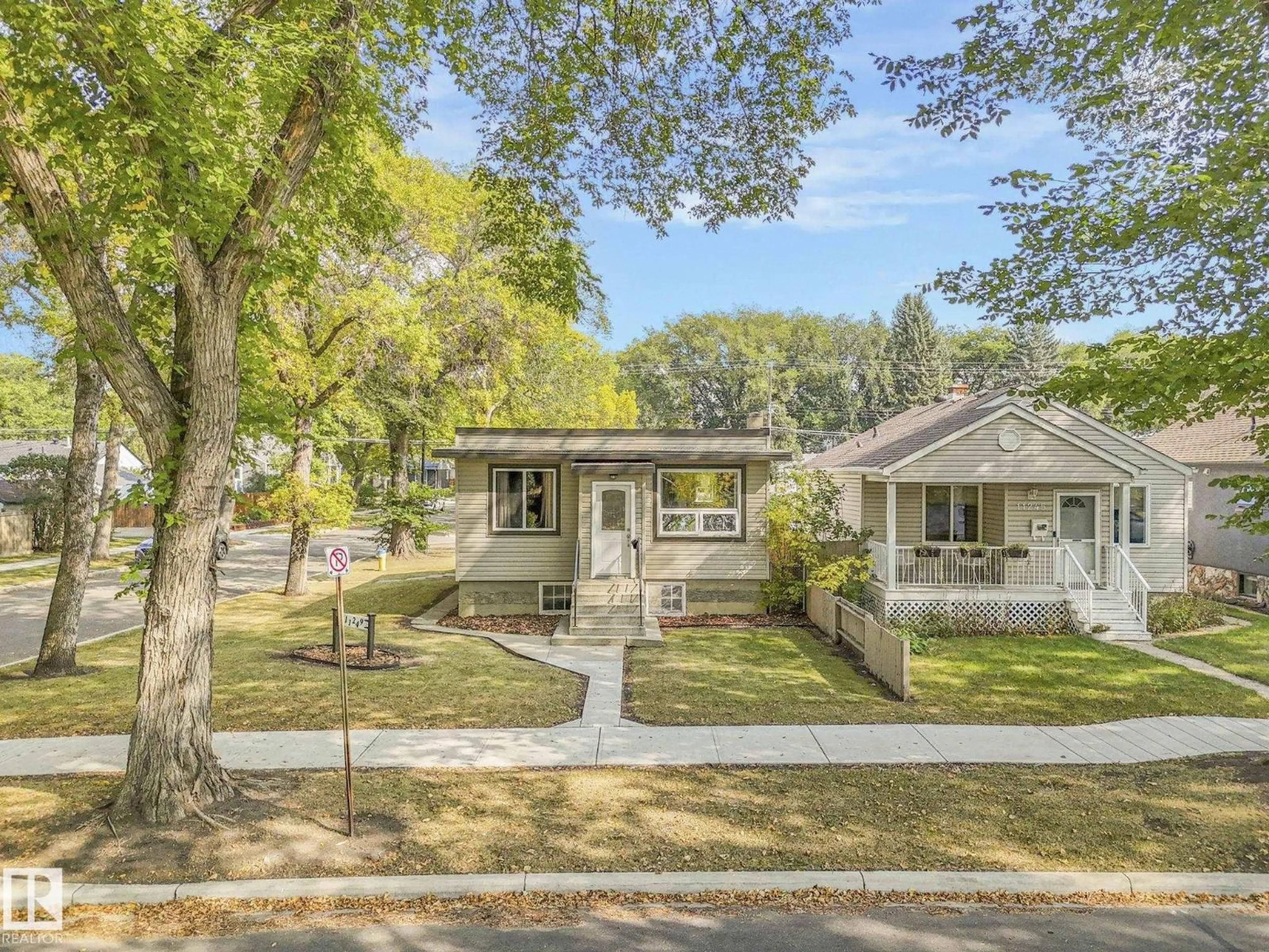 Home with vinyl exterior material, street for 11249 70 ST, Edmonton Alberta T5B1T1