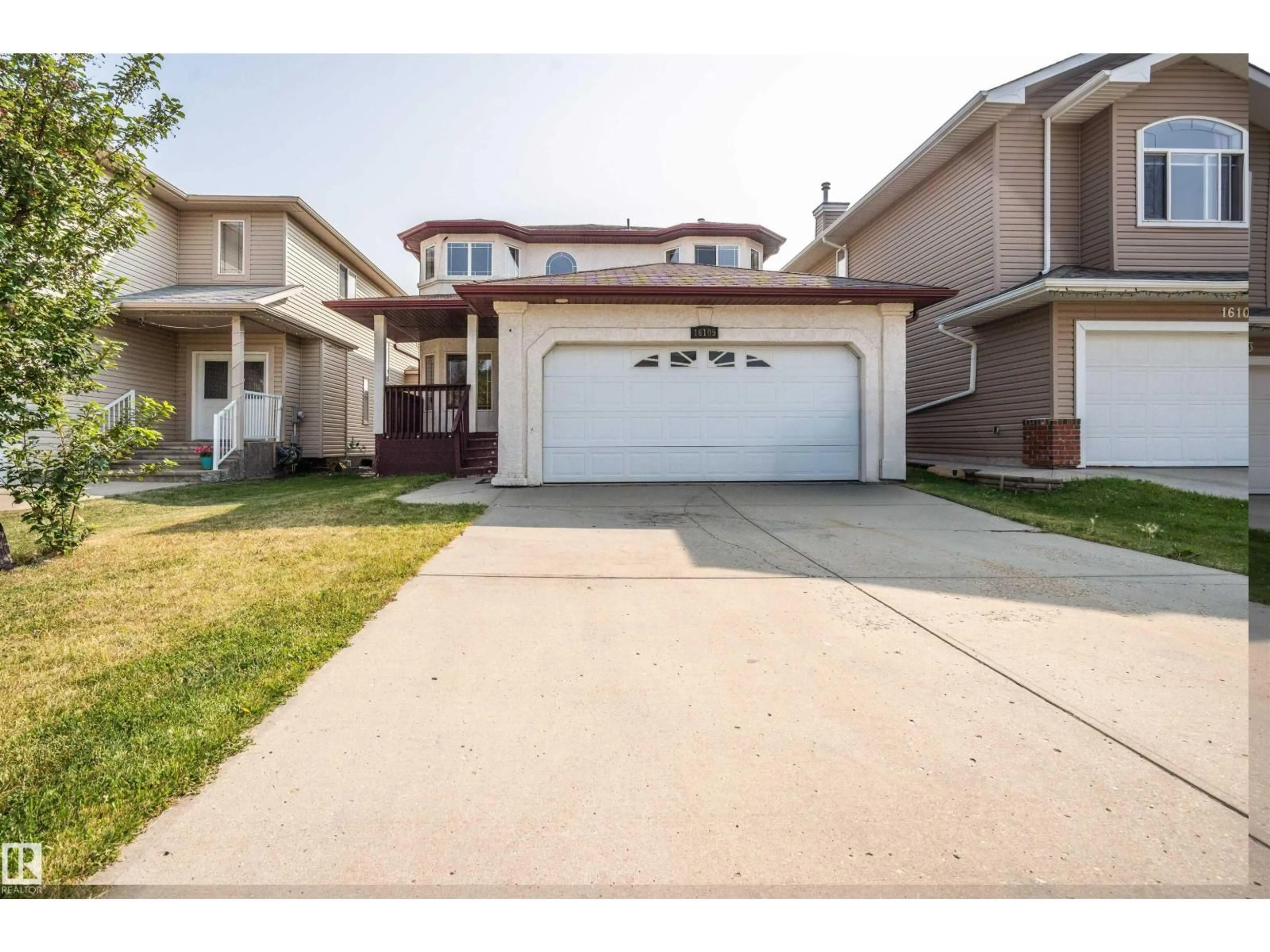 Home with vinyl exterior material, street for 16105 49 ST, Edmonton Alberta T5Y0G7