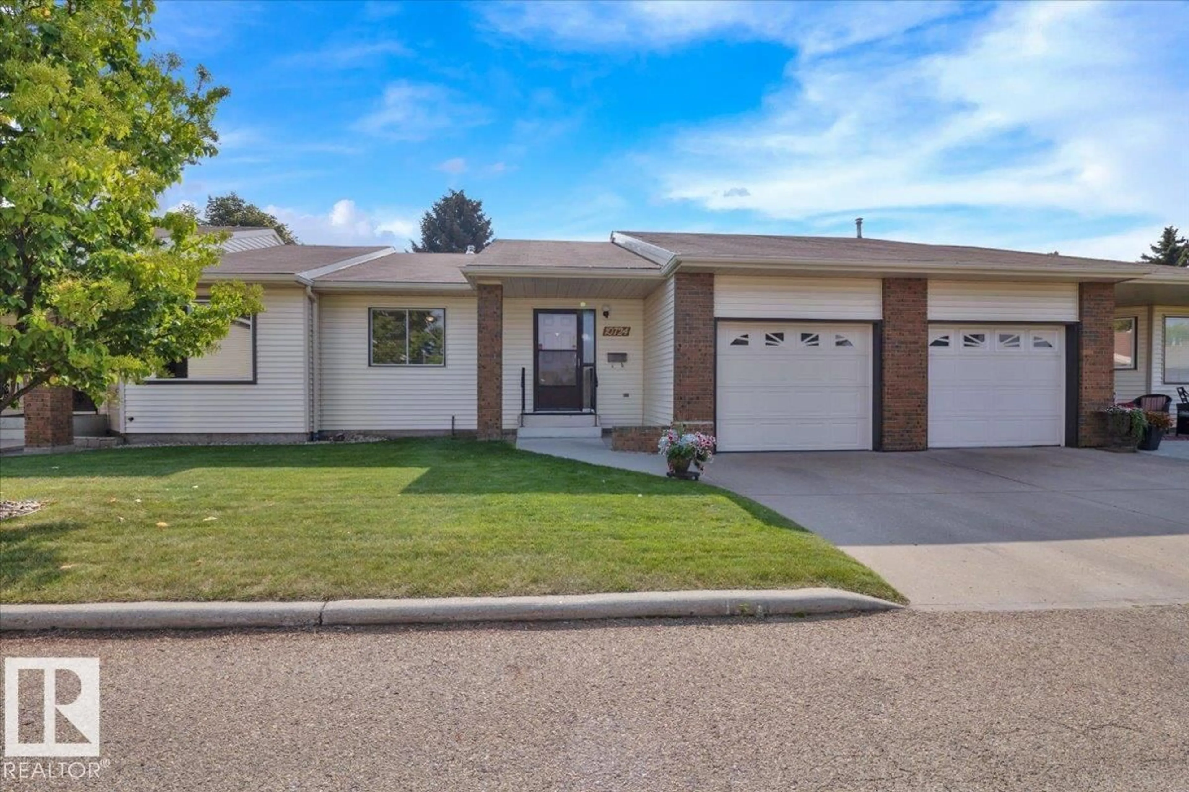 Home with vinyl exterior material, street for 10724 153 AV, Edmonton Alberta T5X5T9
