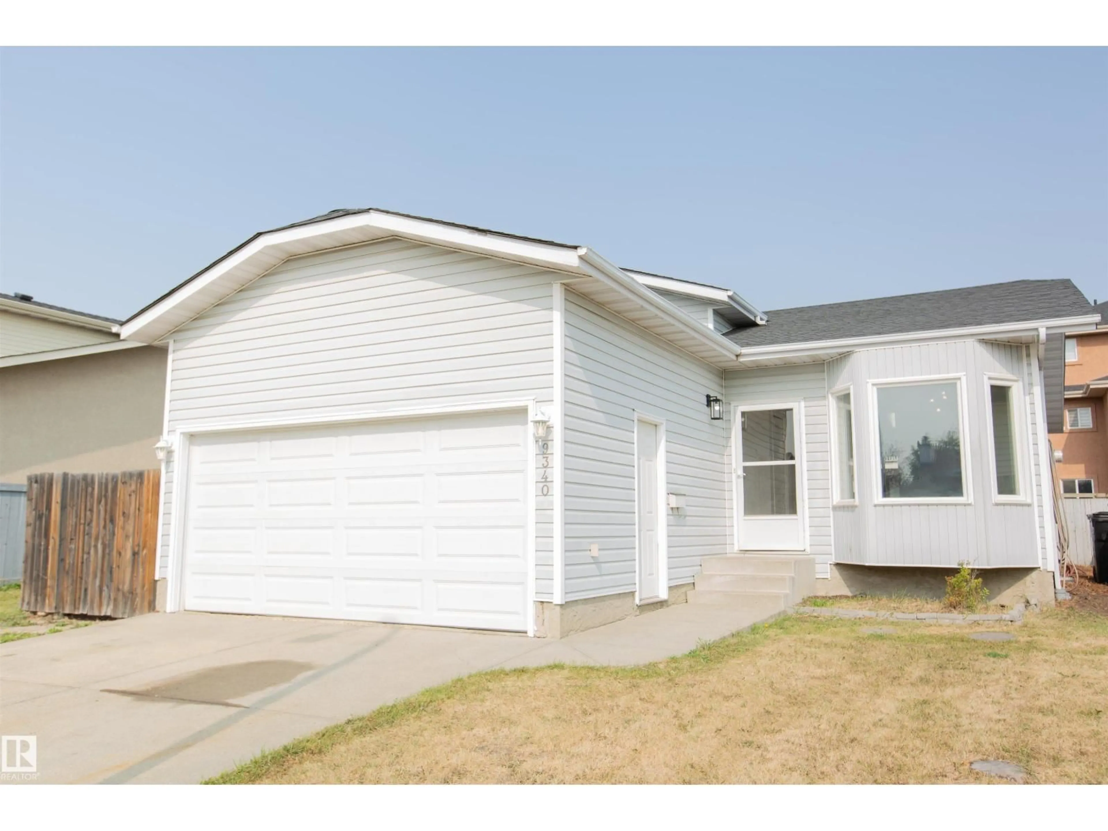 Home with vinyl exterior material, street for 9340 180A AV, Edmonton Alberta T5Z2J3