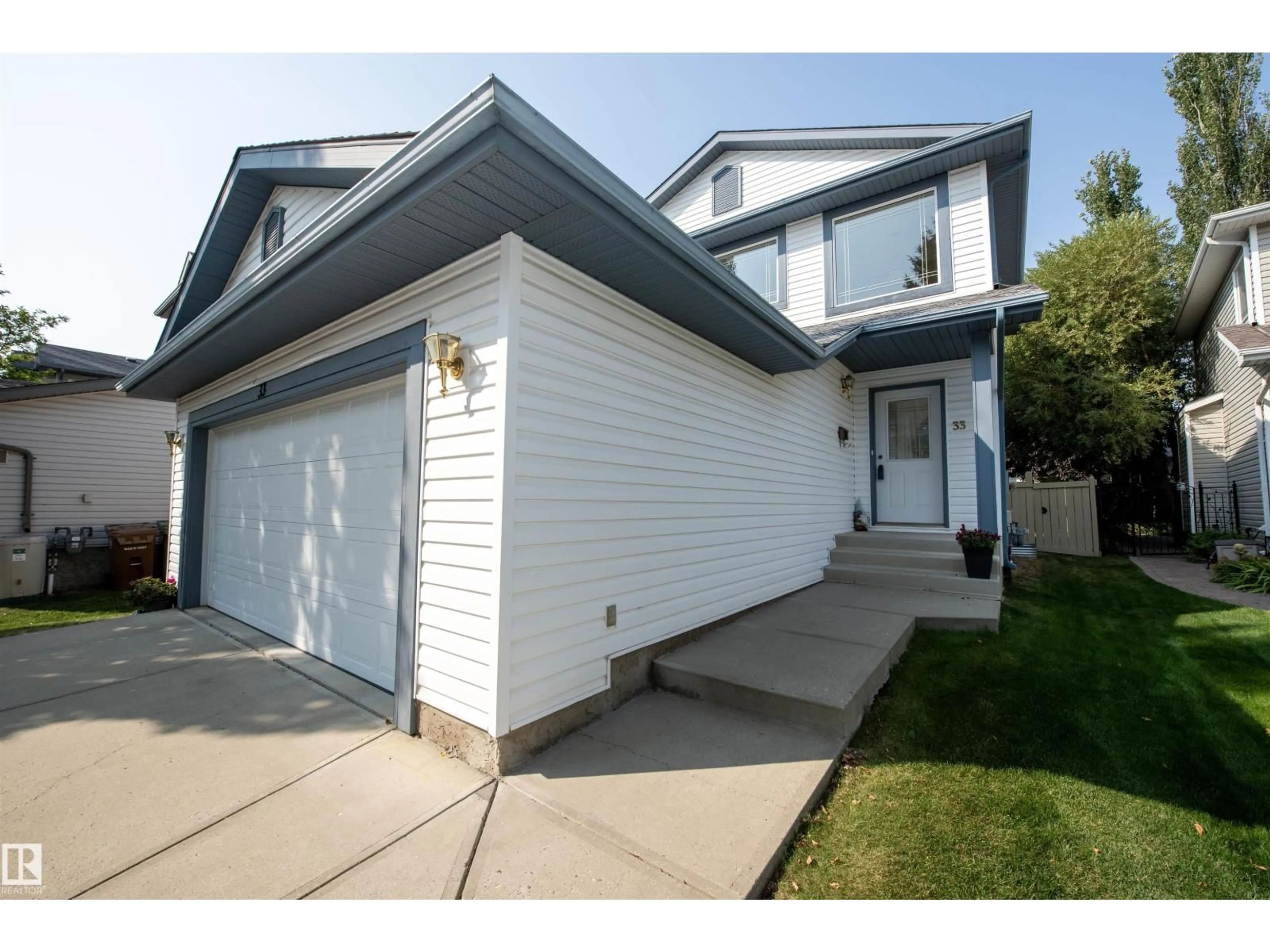 Home with vinyl exterior material, street for 33 EASTCOTT DR, St. Albert Alberta T8N7B1