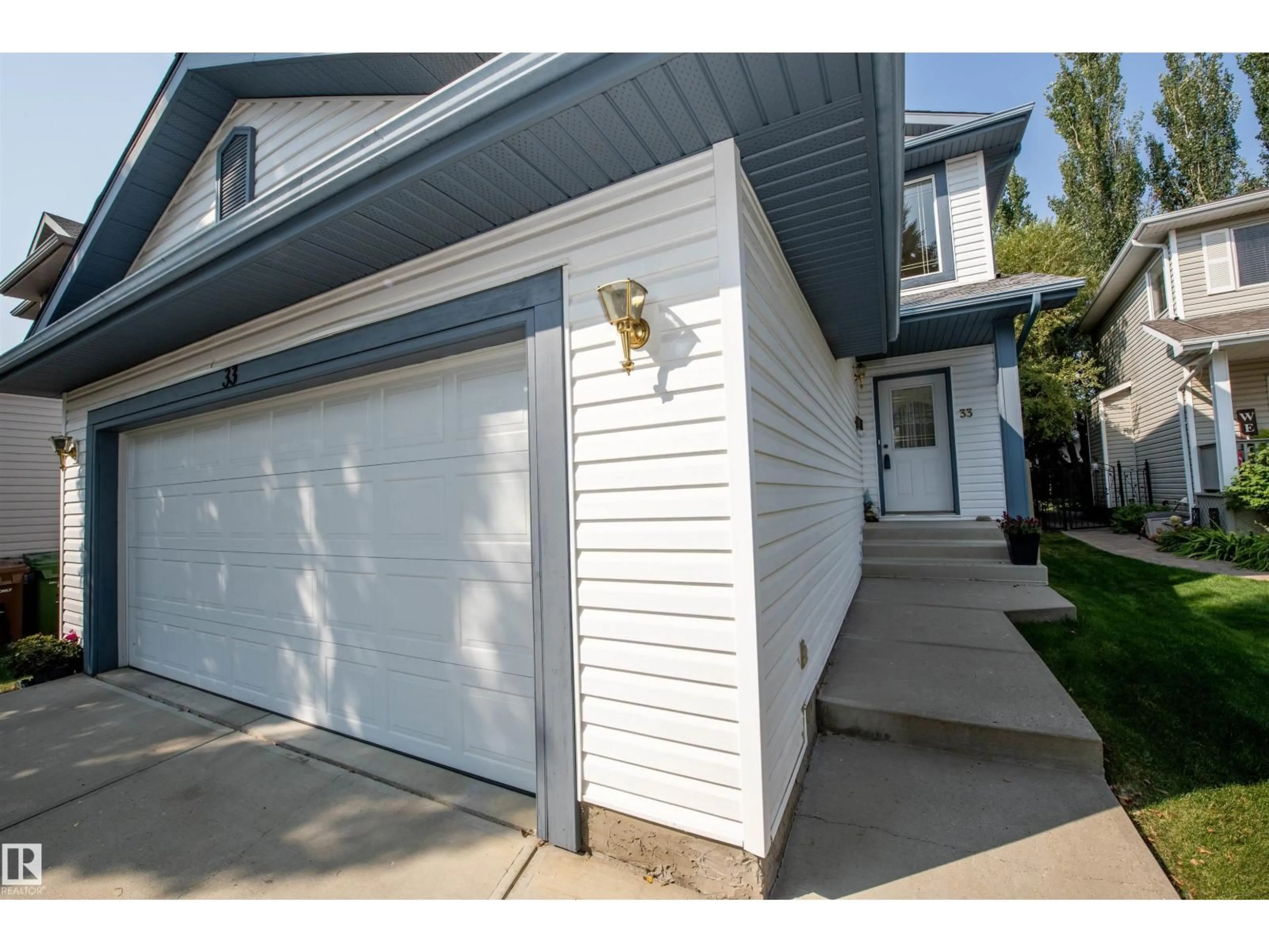 Home with vinyl exterior material, street for 33 EASTCOTT DR, St. Albert Alberta T8N7B1