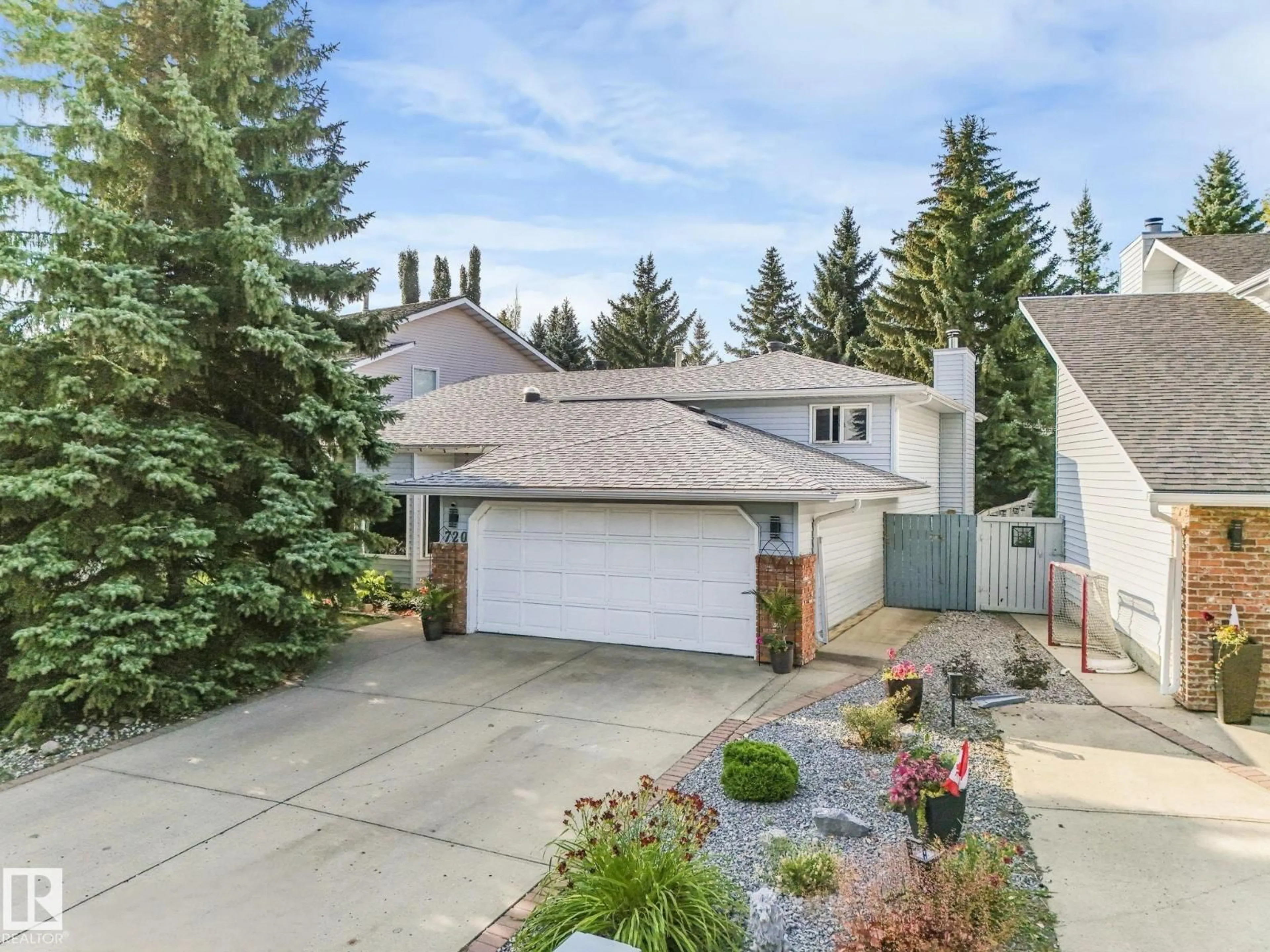 Home with vinyl exterior material, street for 720 HENDRA CR, Edmonton Alberta T6R1S6