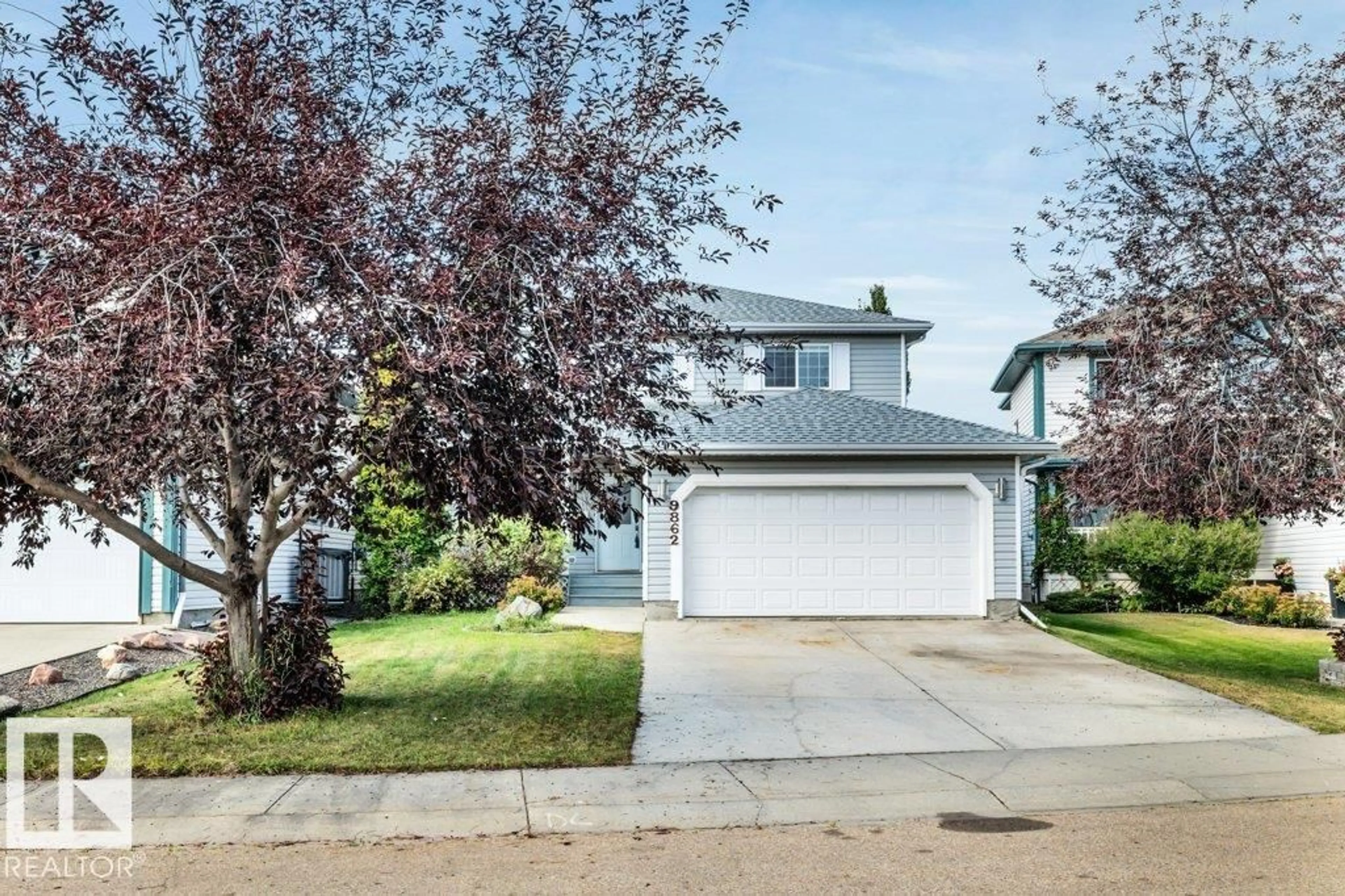 Home with vinyl exterior material, street for 9862 180 AV, Edmonton Alberta T5X6A2