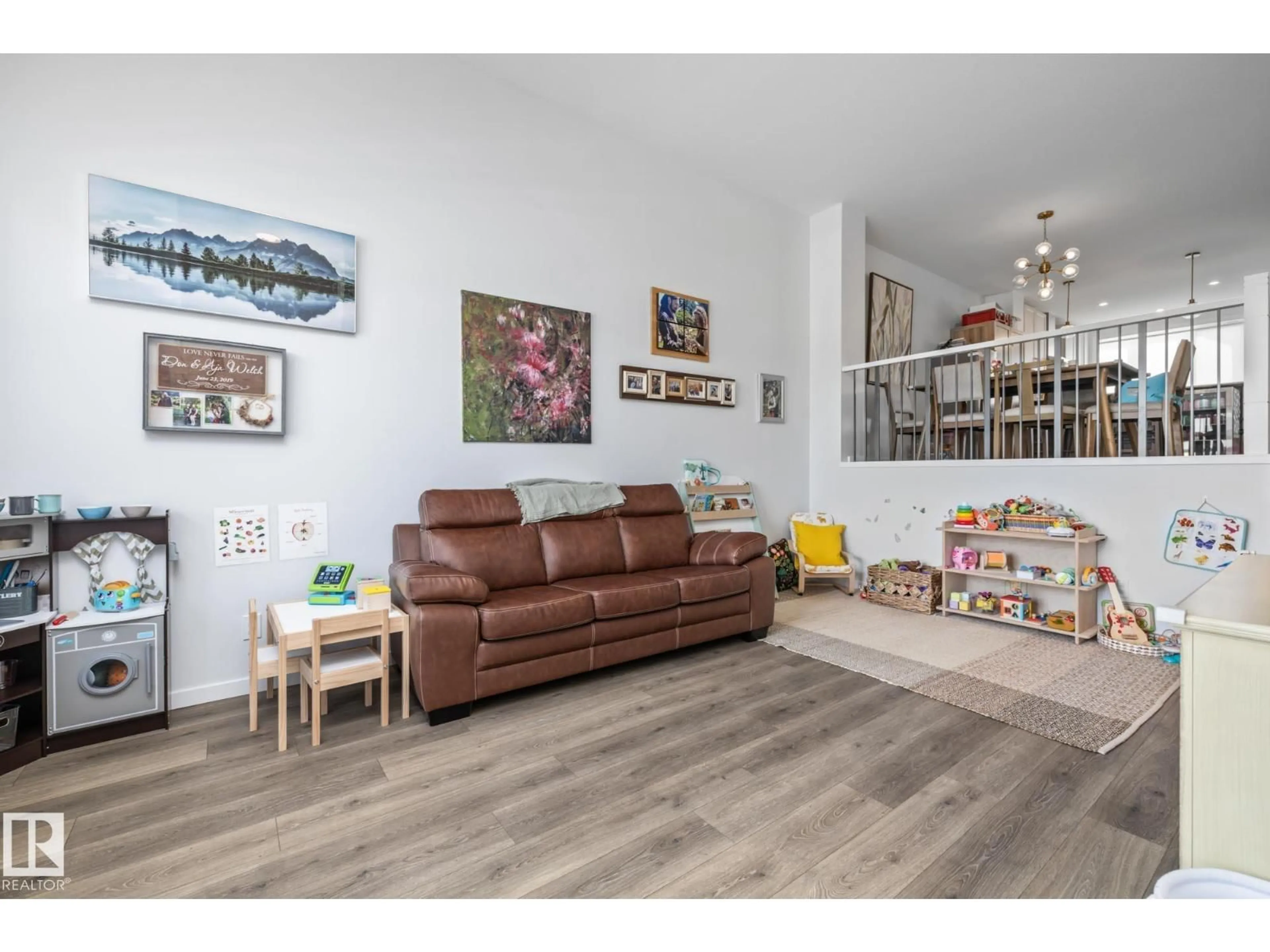 Living room with furniture, wood/laminate floor for 17227 3 ST, Edmonton Alberta T5Y6G4