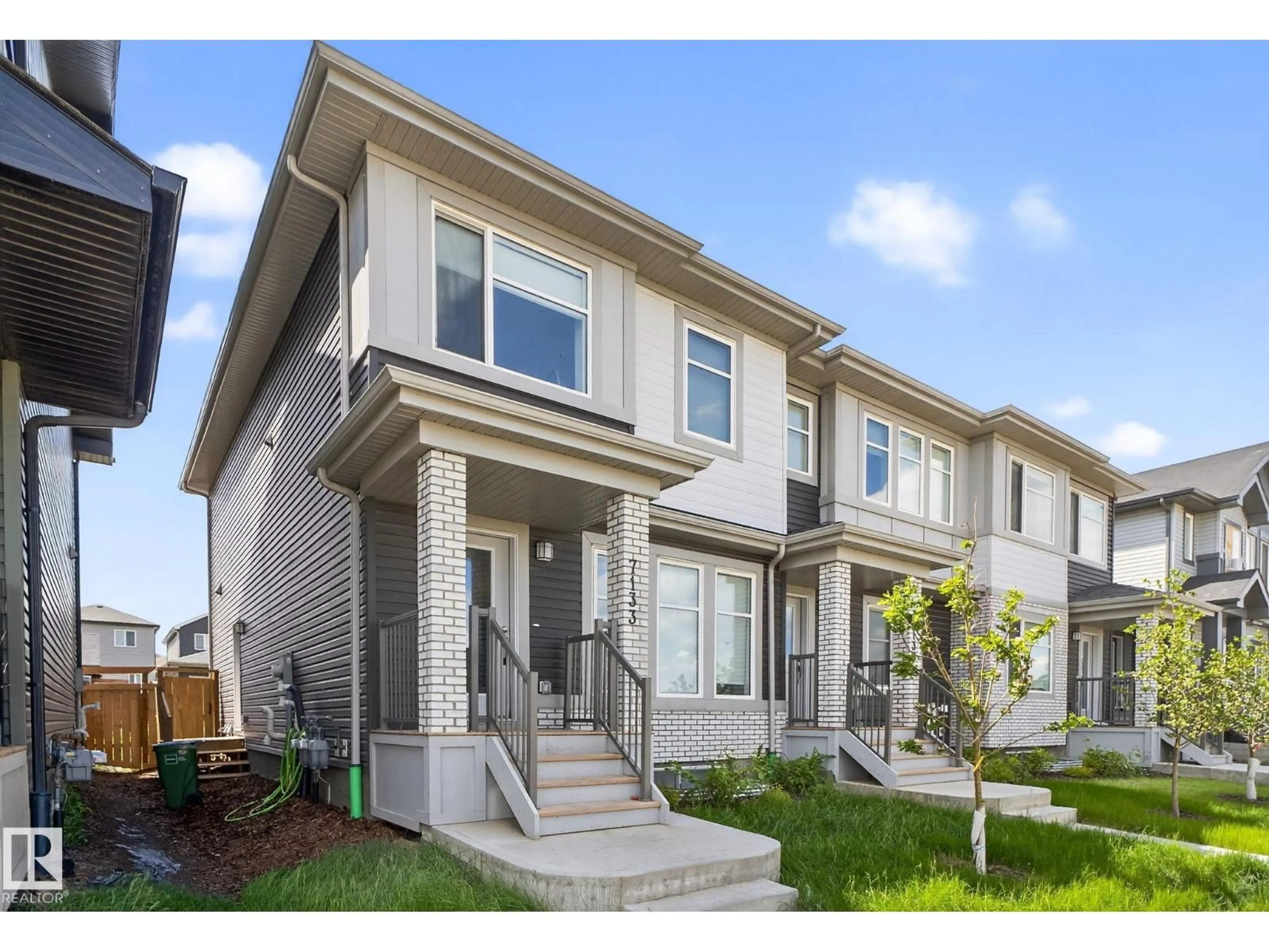 Home with vinyl exterior material, street for NW - 7133/35/37 178 AV, Edmonton Alberta T5Z0T8