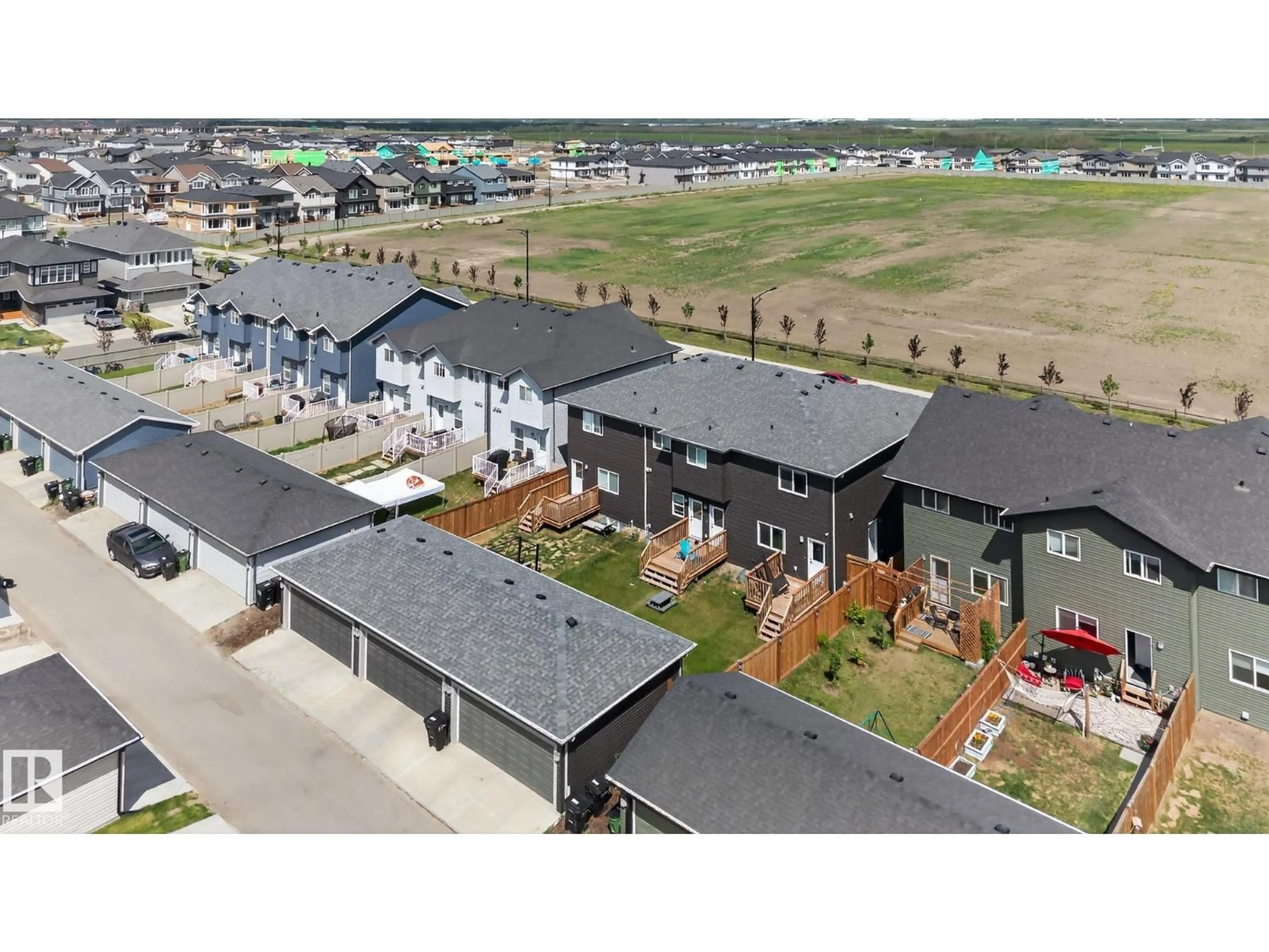 A pic from outside/outdoor area/front of a property/back of a property/a pic from drone, unknown for NW - 7133/35/37 178 AV, Edmonton Alberta T5Z0T8