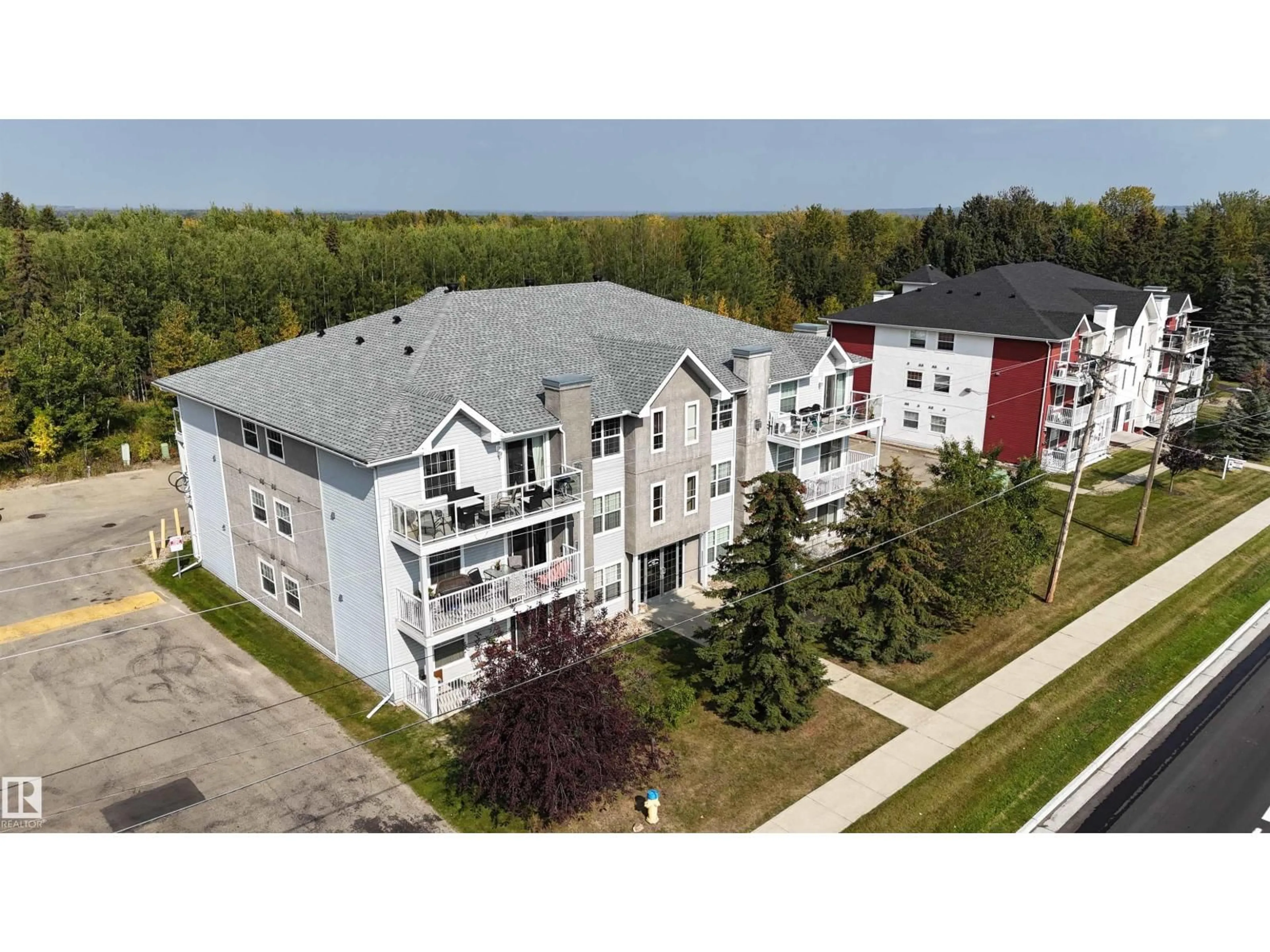 A pic from outside/outdoor area/front of a property/back of a property/a pic from drone, building for 304 - 4104 50 AV, Drayton Valley Alberta T7A0A3