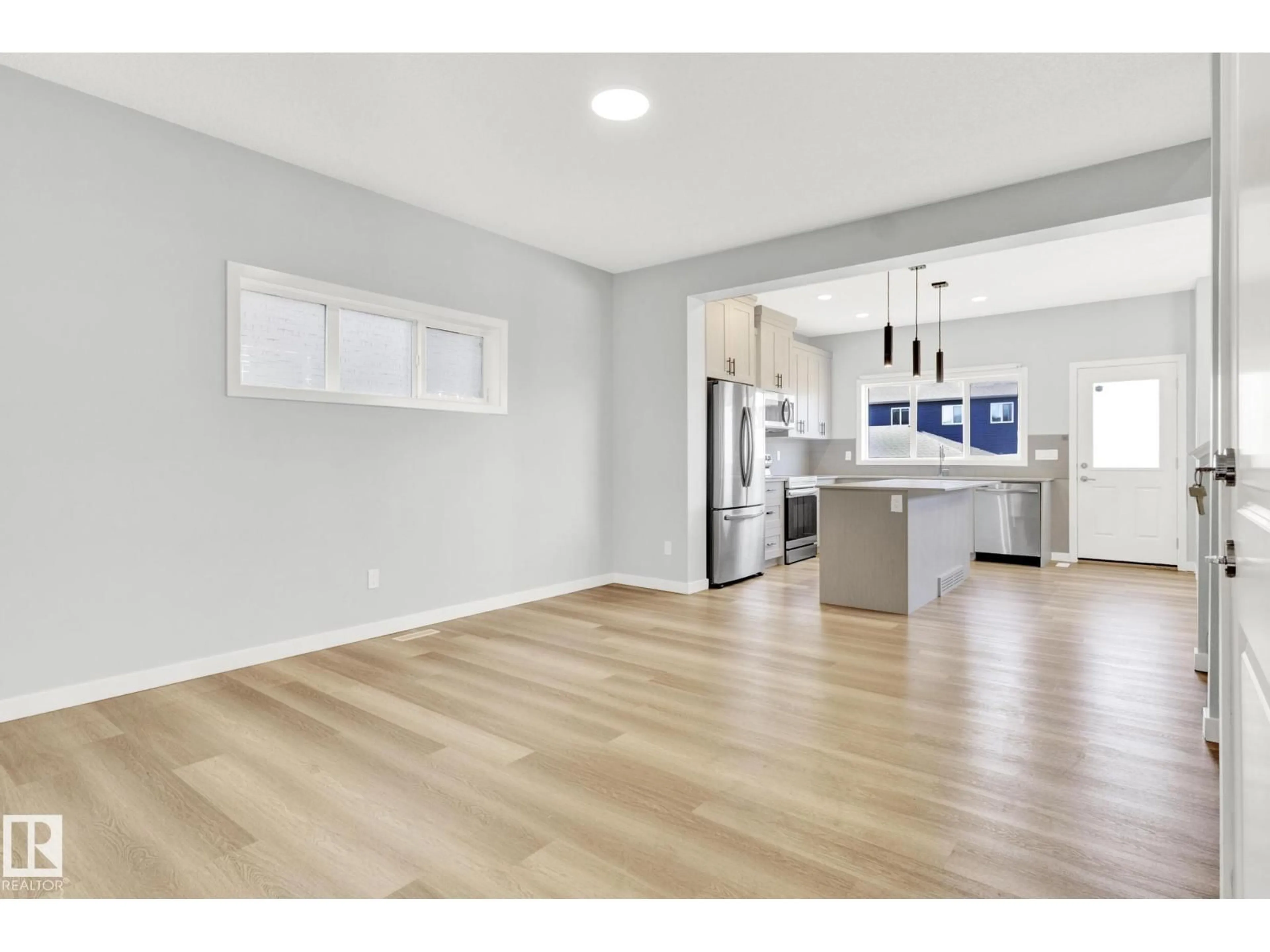 Open concept kitchen, wood/laminate floor for CI SW - 1627 PLUM CIRCLE, Edmonton Alberta T6X2X1