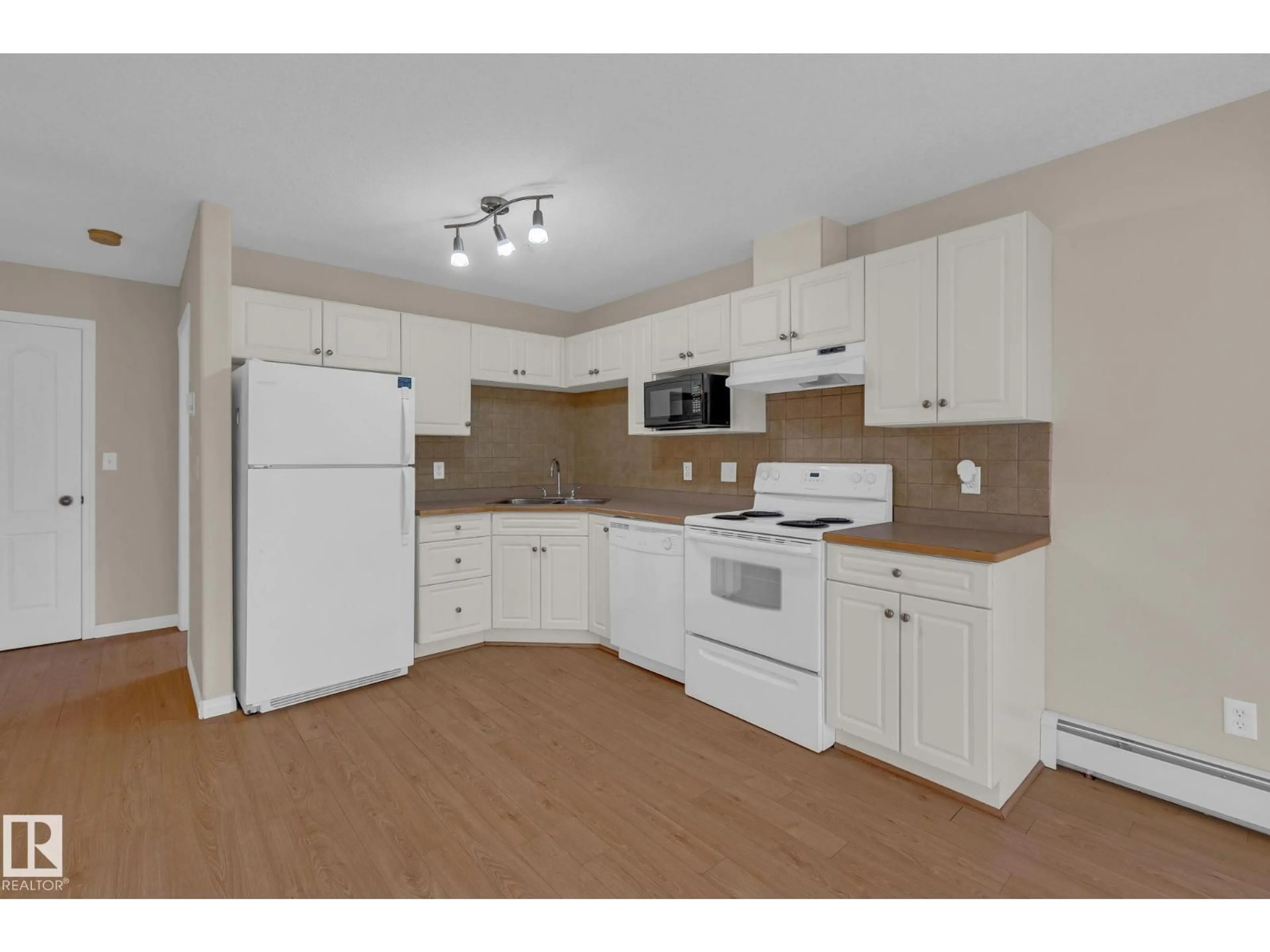 Standard kitchen, wood/laminate floor for #212 - 12550 140 AV, Edmonton Alberta T5X6J4