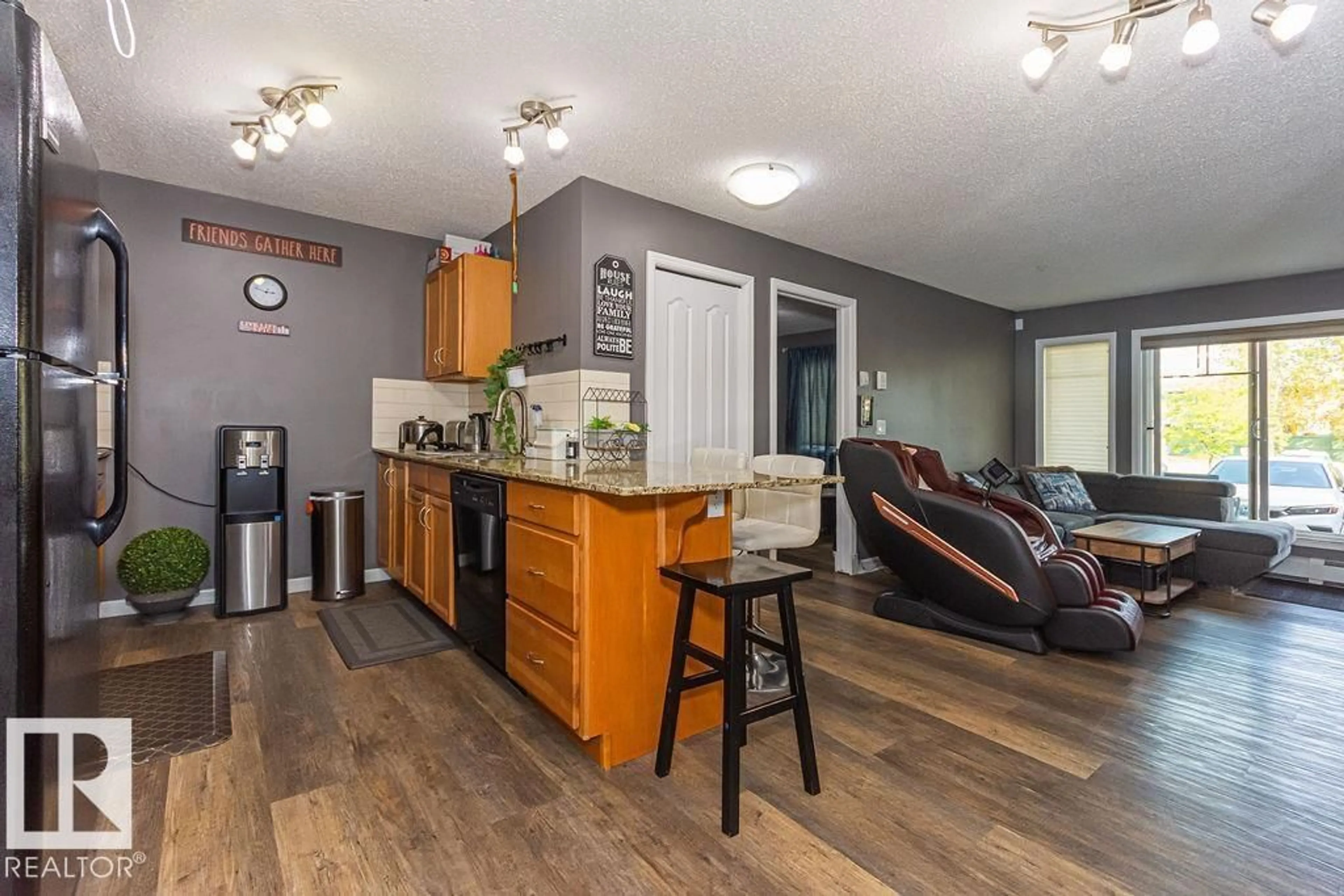 Open concept kitchen, wood/laminate floor for 271 - 117 CHARLOTTE WY, Sherwood Park Alberta T8H0N9