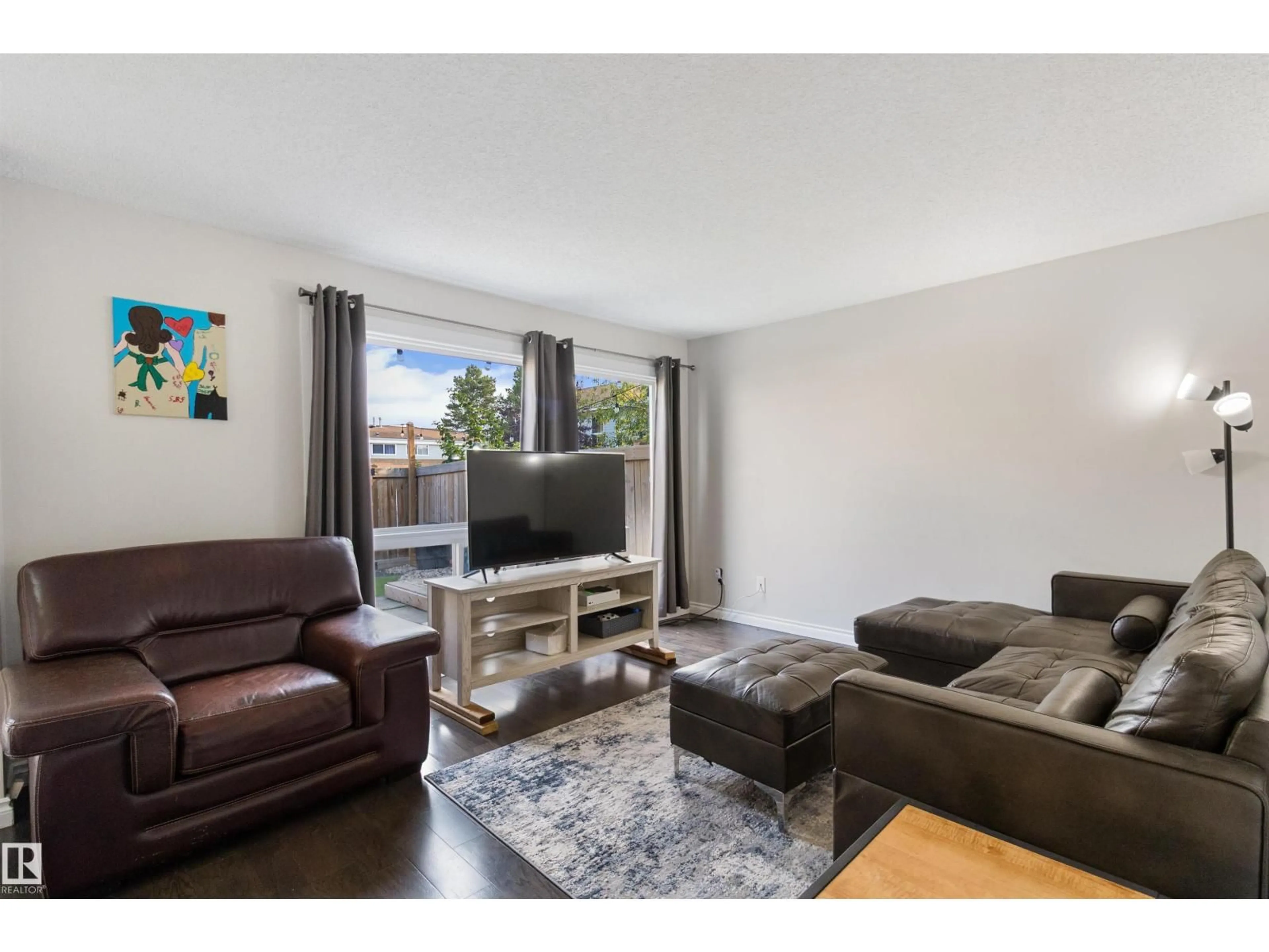 Living room with furniture, wood/laminate floor for 199 - 168 GRANDIN VG, St. Albert Alberta T8N2J3