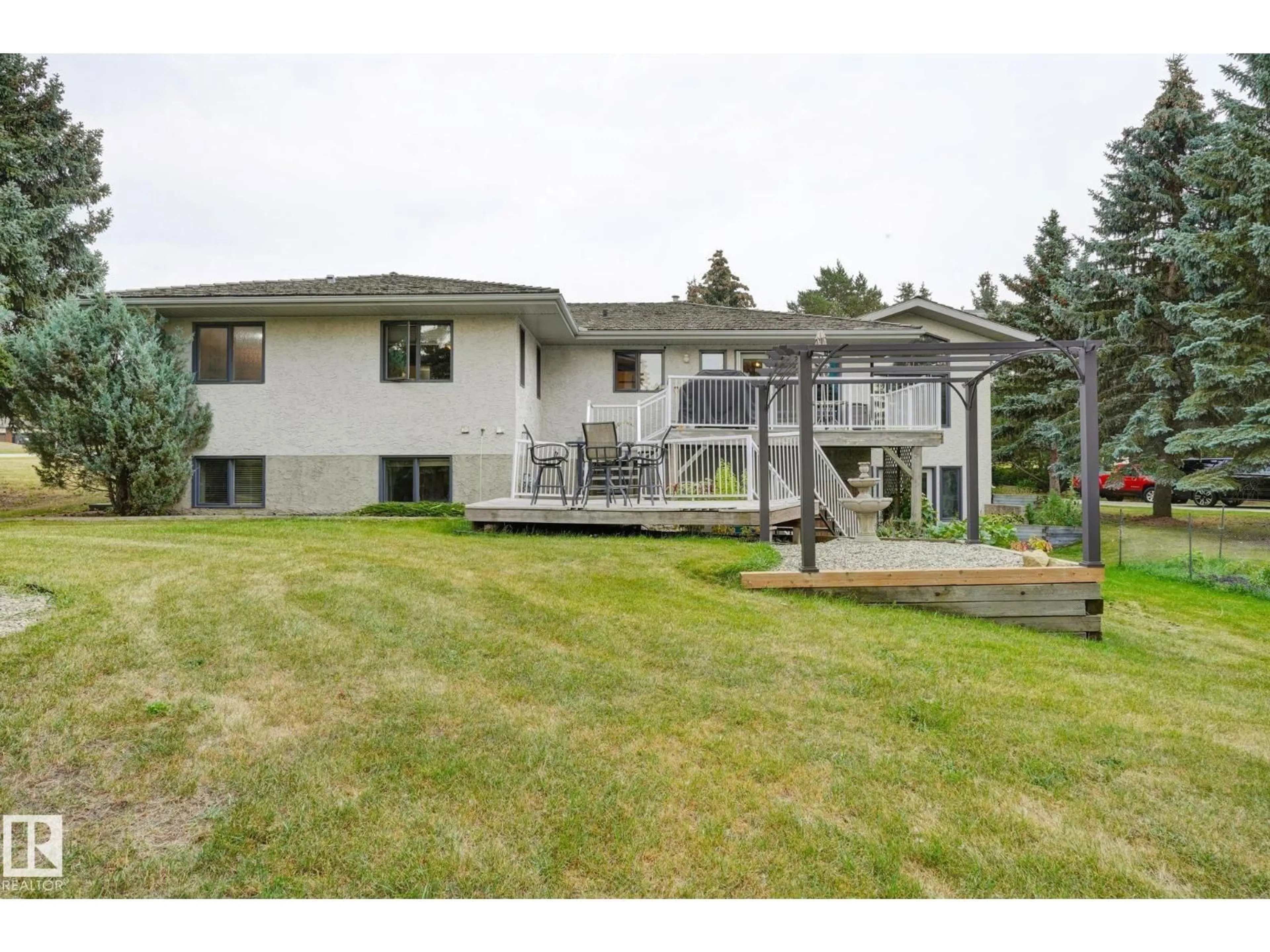 A pic from outside/outdoor area/front of a property/back of a property/a pic from drone, mountain view for 79 25112 TWP ROAD 542A, Rural Sturgeon County Alberta T8T0B2