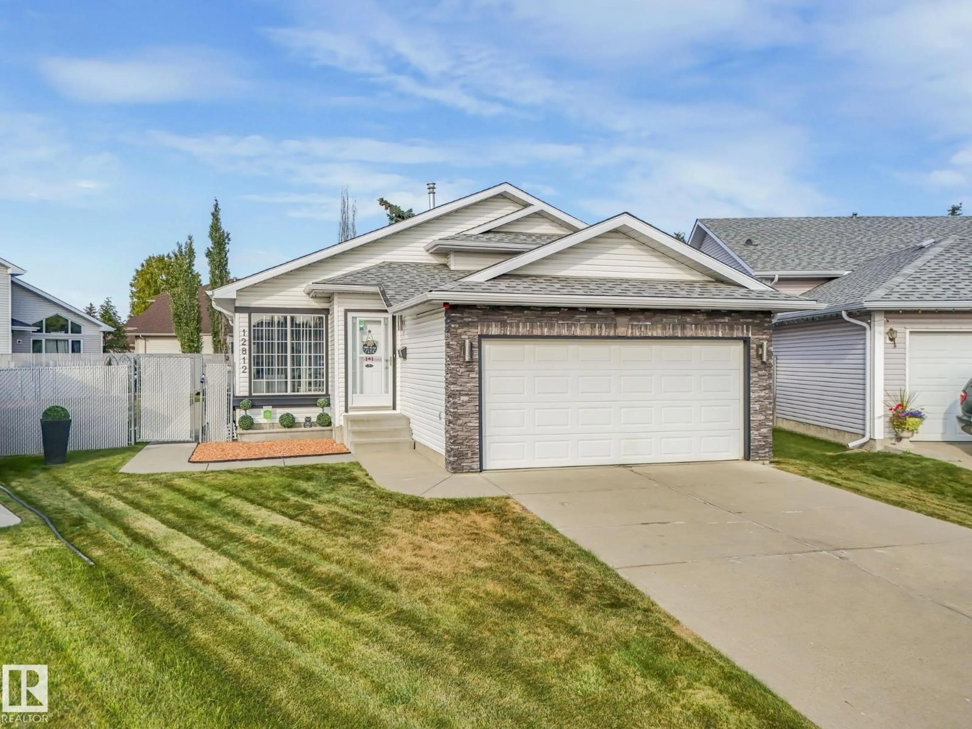 Home with vinyl exterior material, street for 12812 146 AV, Edmonton Alberta T6V1C5