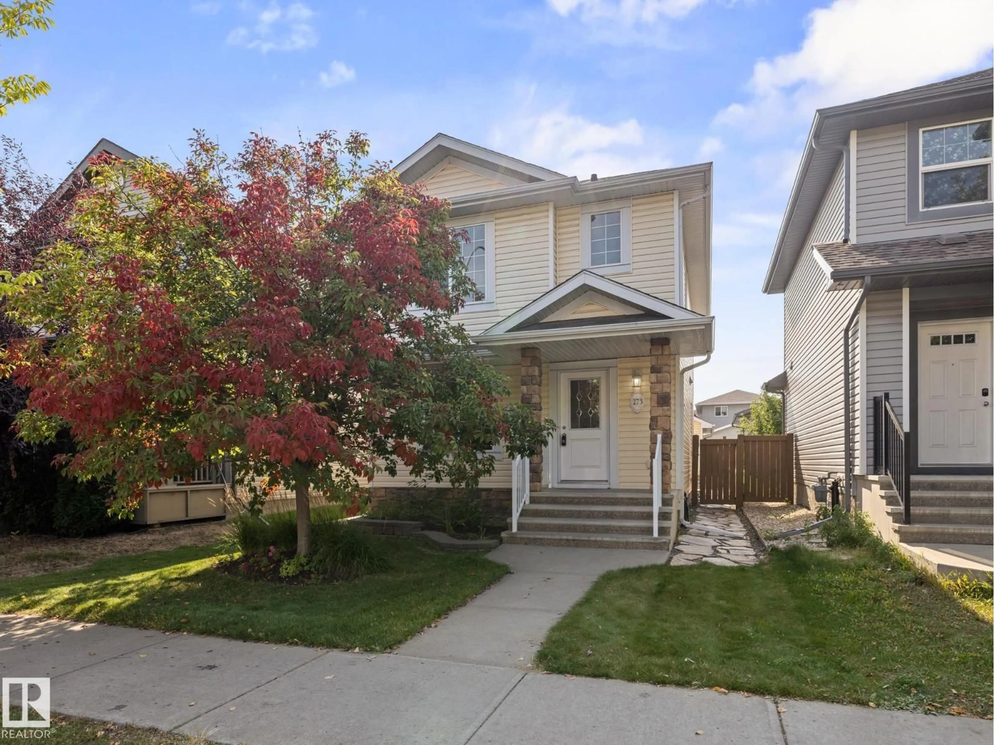 Home with vinyl exterior material, street for 273 MCCONACHIE DR, Edmonton Alberta T5Y0M7