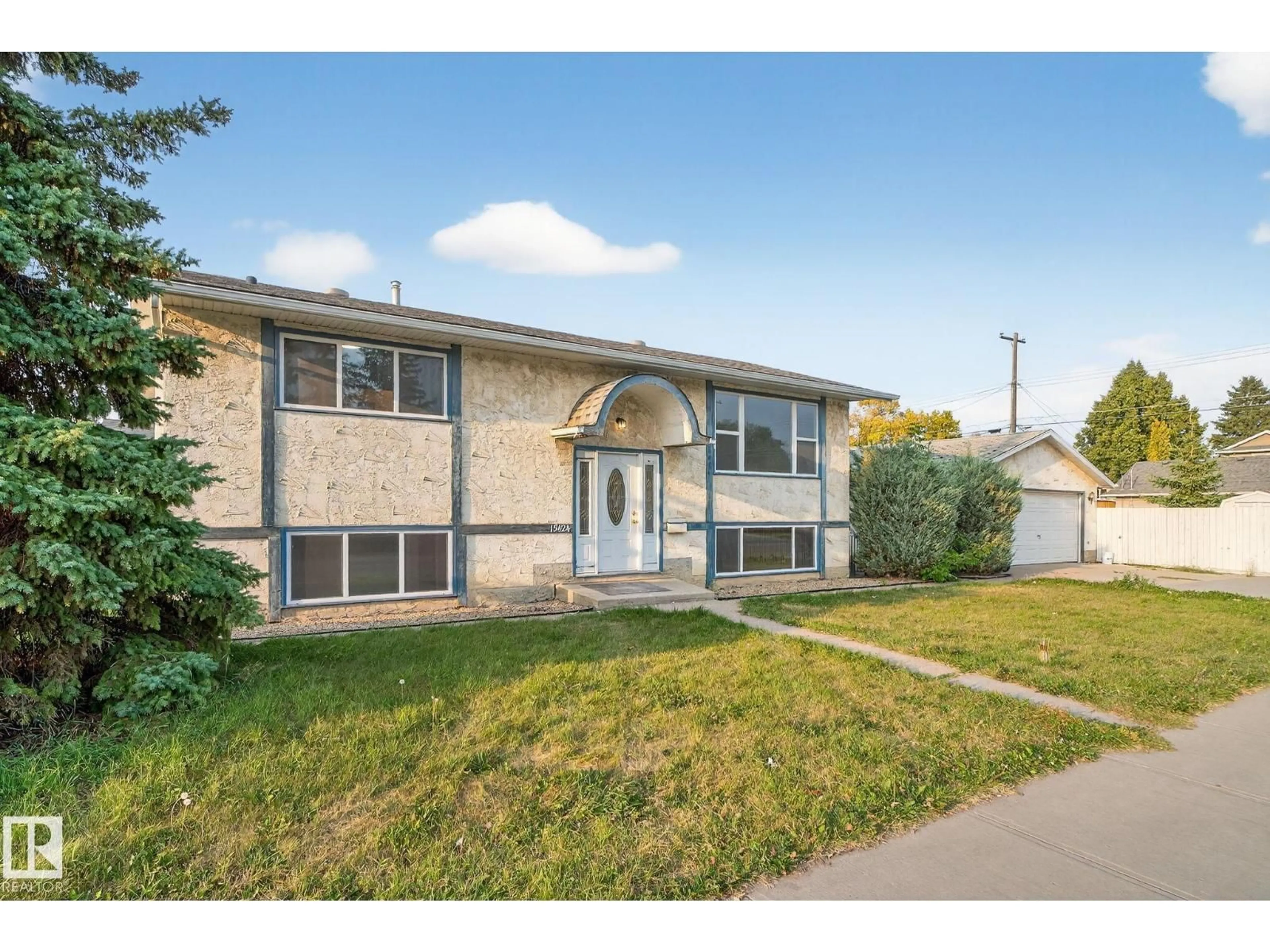 Home with brick exterior material, street for NW - 15424 99 AV, Edmonton Alberta T5P4K5