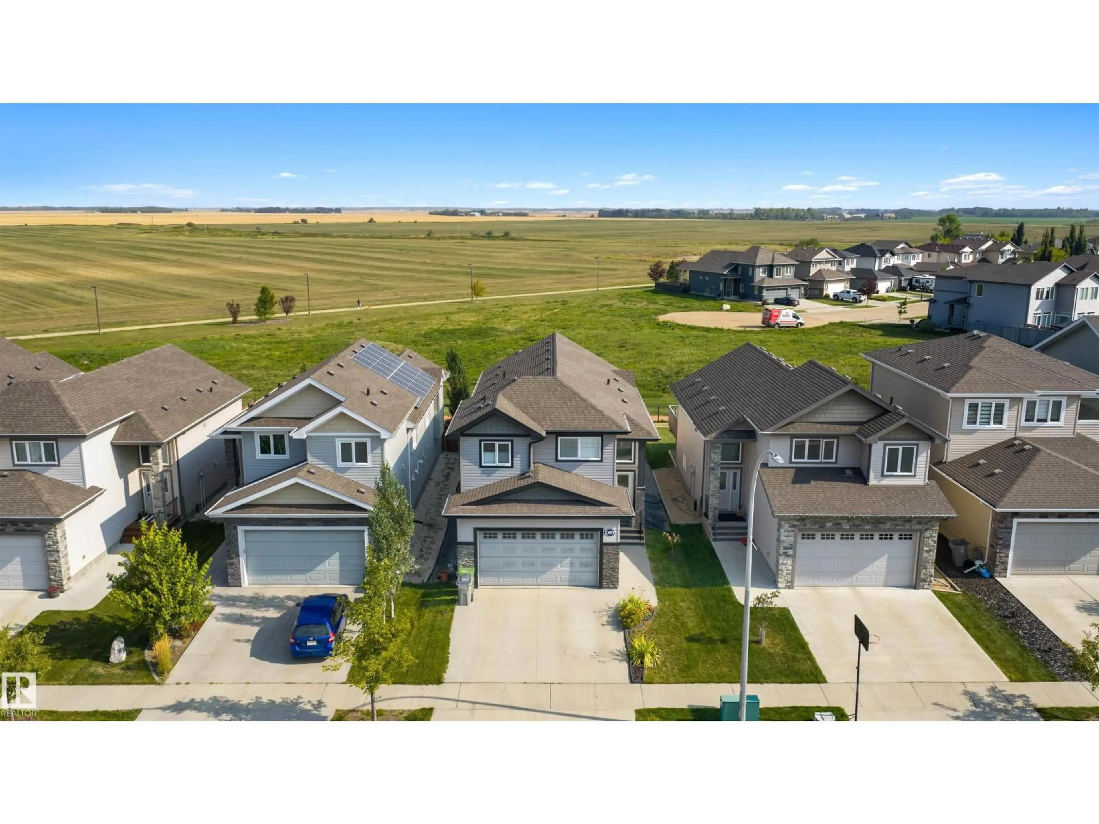 A pic from outside/outdoor area/front of a property/back of a property/a pic from drone, street for 10609 96 ST, Morinville Alberta T8R2N5