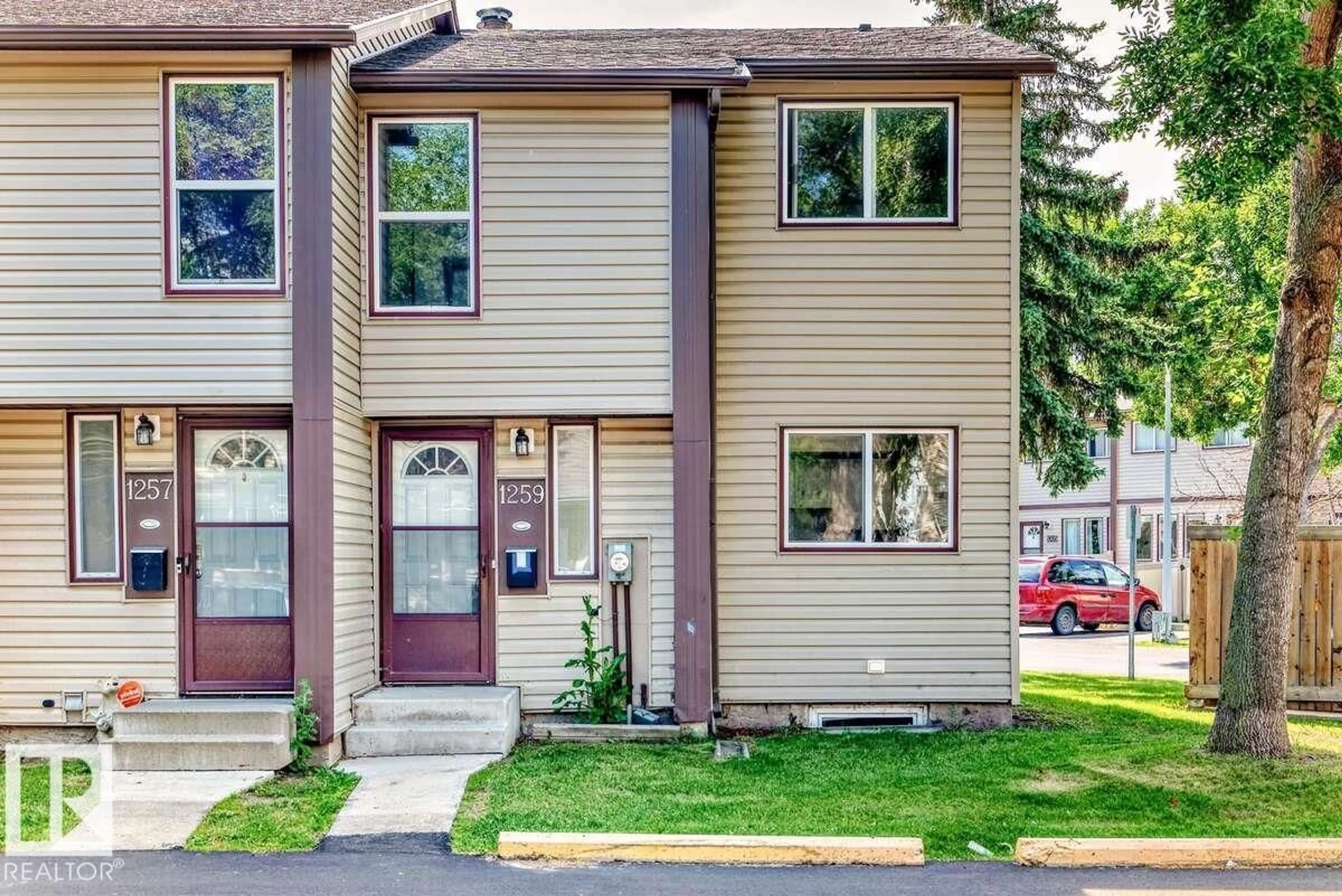 Home with vinyl exterior material, street for 1259 HOOKE RD, Edmonton Alberta T5A4A4
