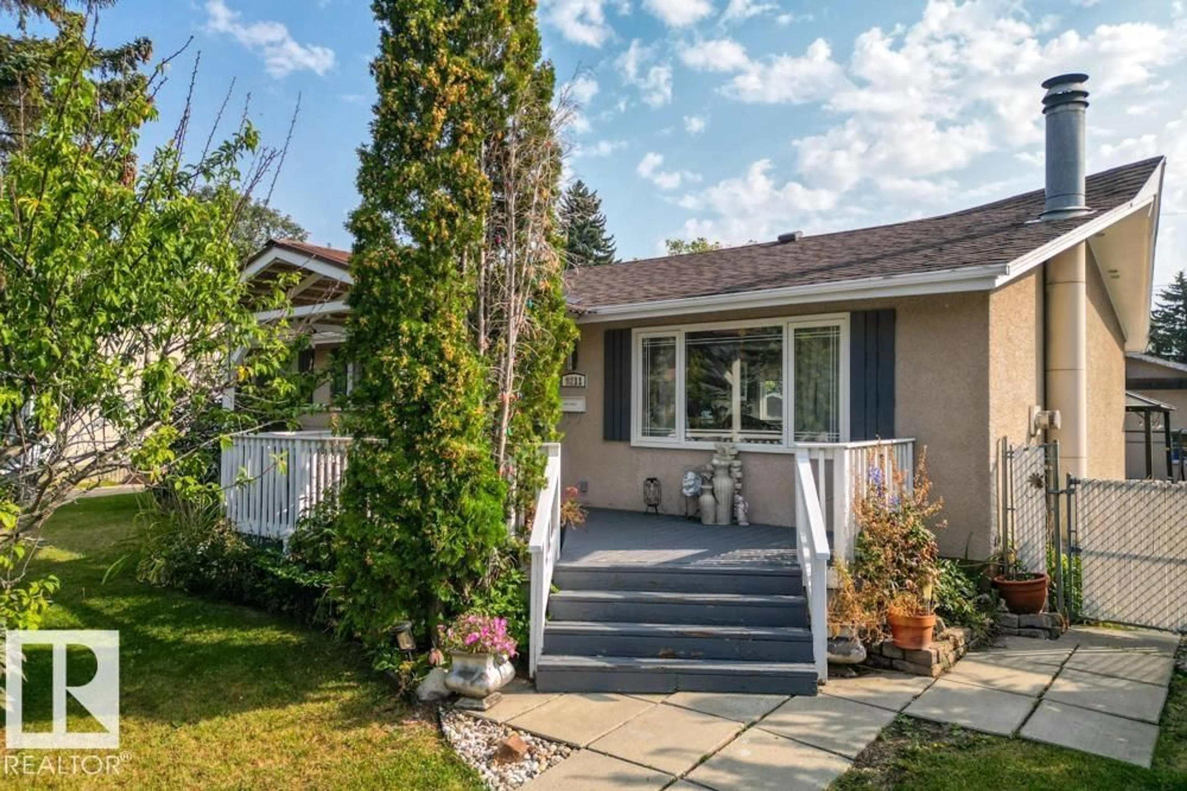 Home with vinyl exterior material, street for 9211 69 ST, Edmonton Alberta T6B1V8