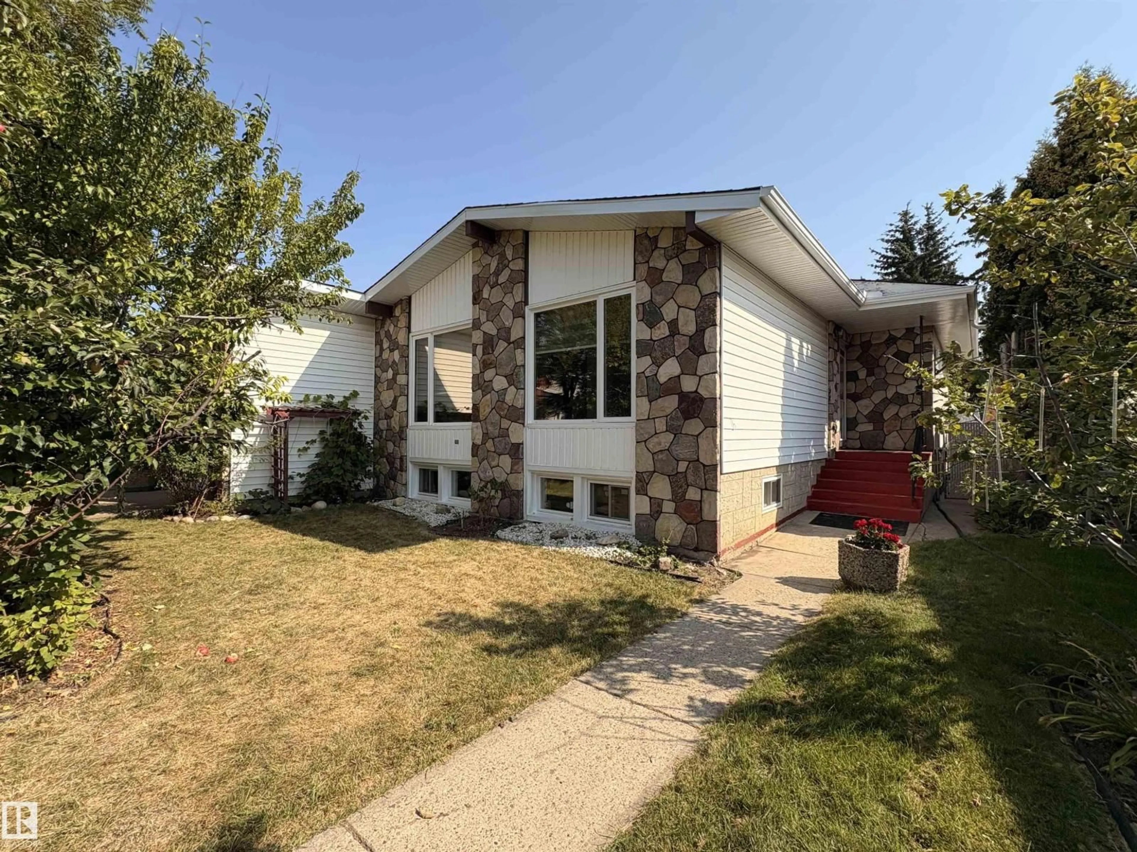 Home with vinyl exterior material, street for 3431 86 ST, Edmonton Alberta T6K0H5
