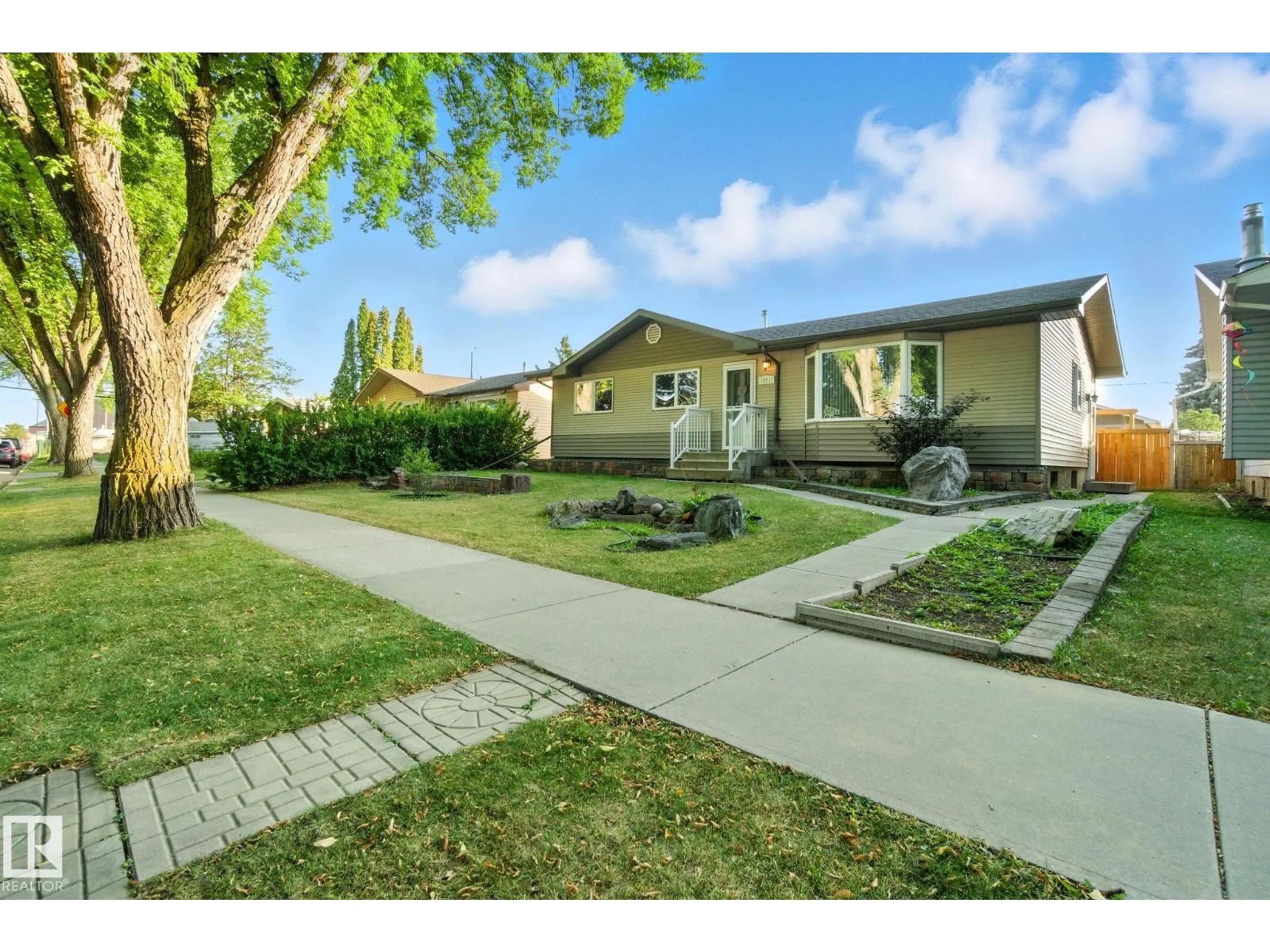 A pic from outside/outdoor area/front of a property/back of a property/a pic from drone, street for 15711 89 AV, Edmonton Alberta T5R4R4
