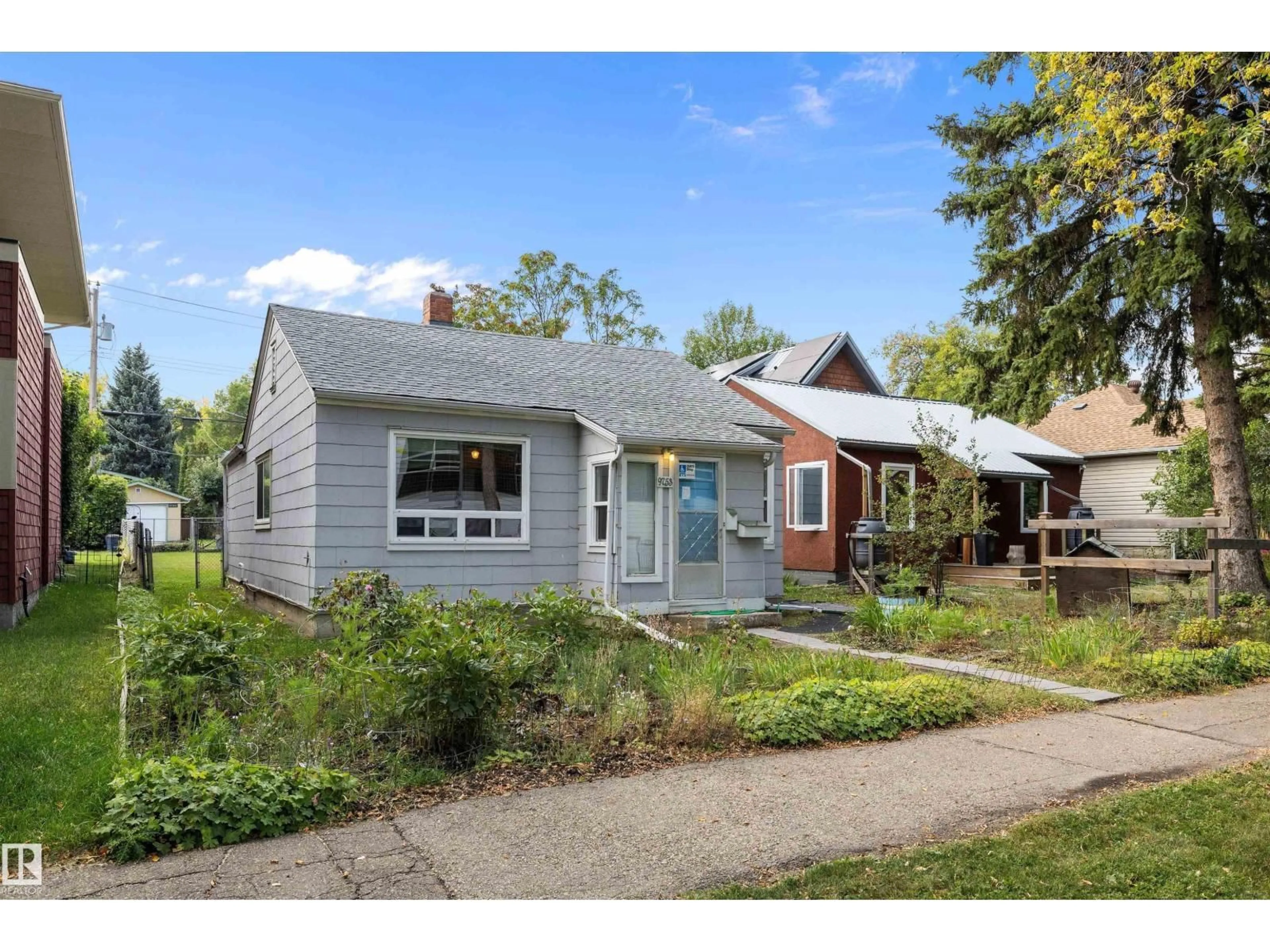 Home with vinyl exterior material, street for 9753 79 AV, Edmonton Alberta T6E1P9