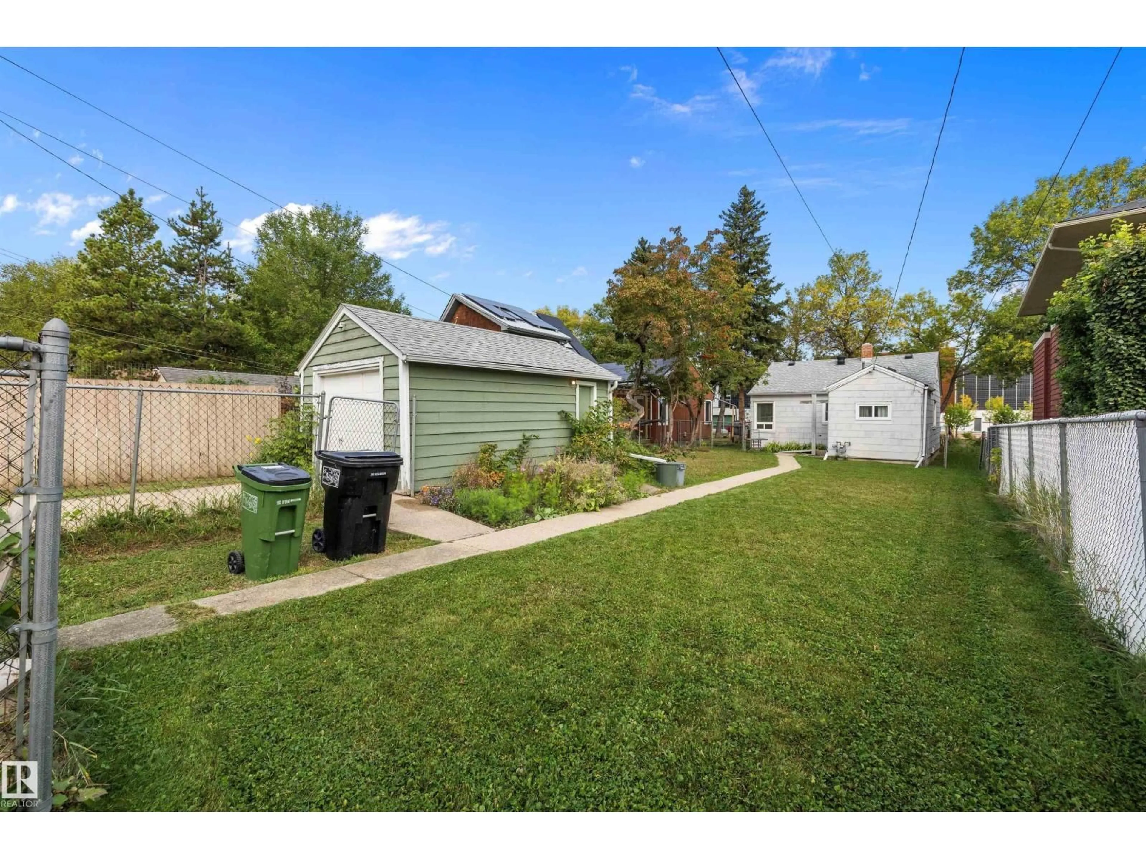 A pic from outside/outdoor area/front of a property/back of a property/a pic from drone, street for 9753 79 AV, Edmonton Alberta T6E1P9