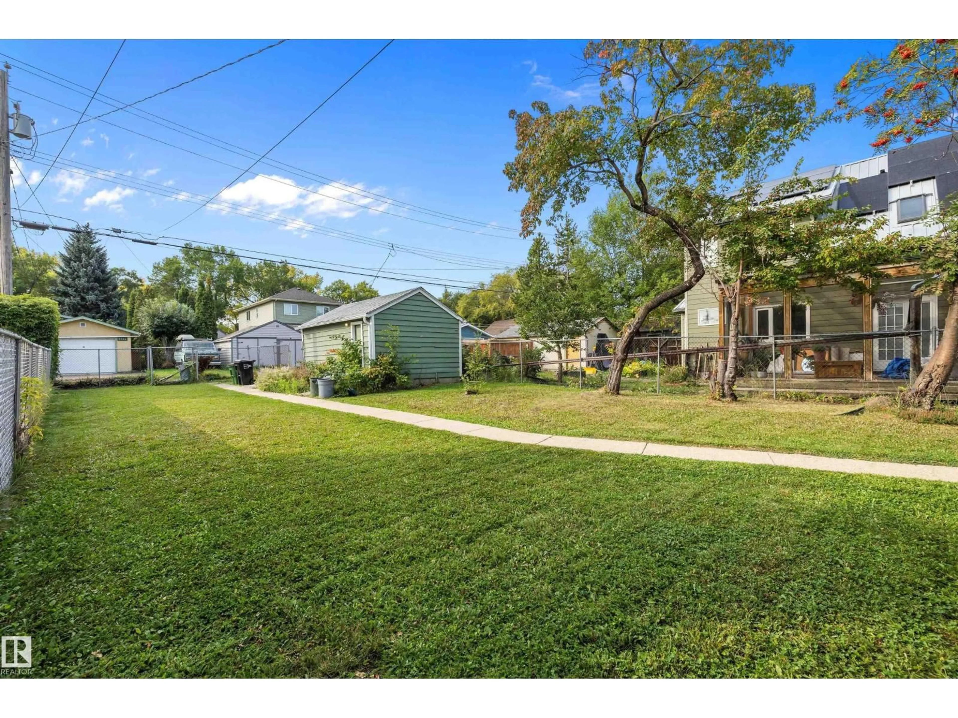 A pic from outside/outdoor area/front of a property/back of a property/a pic from drone, street for 9753 79 AV, Edmonton Alberta T6E1P9