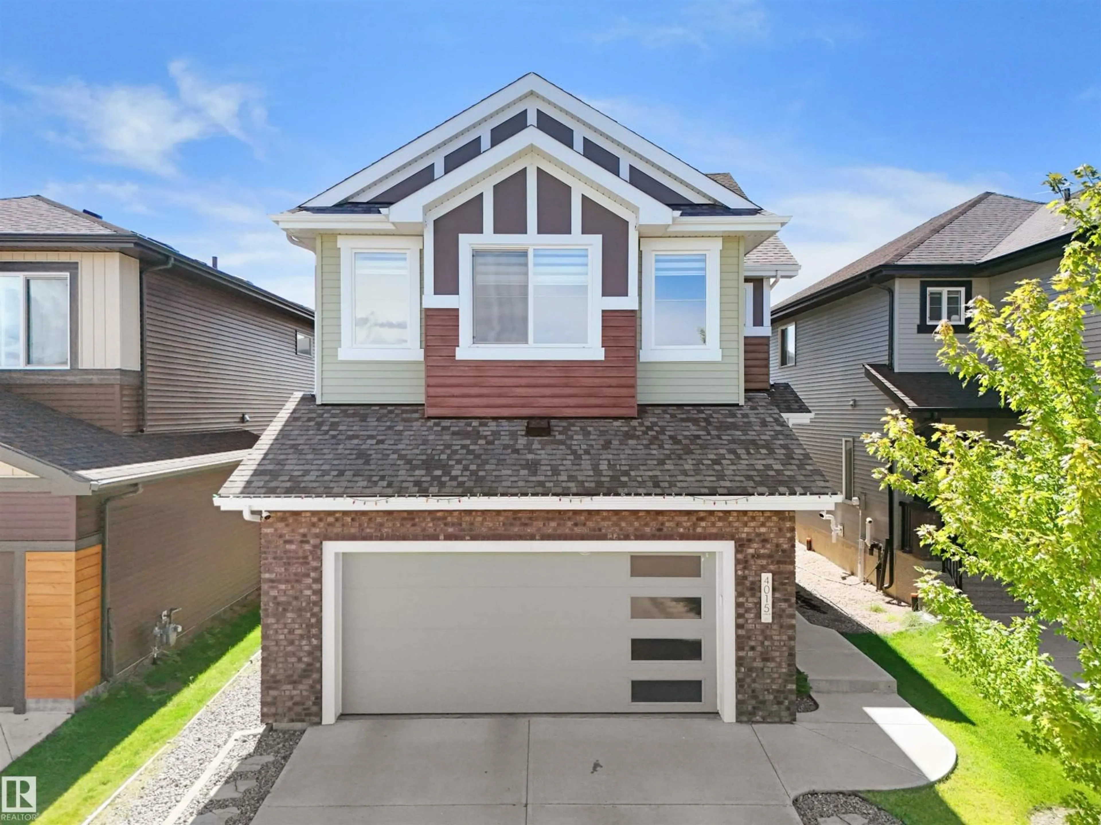 Home with vinyl exterior material, street for 4015 6 AV SW, Edmonton Alberta T6X2J1