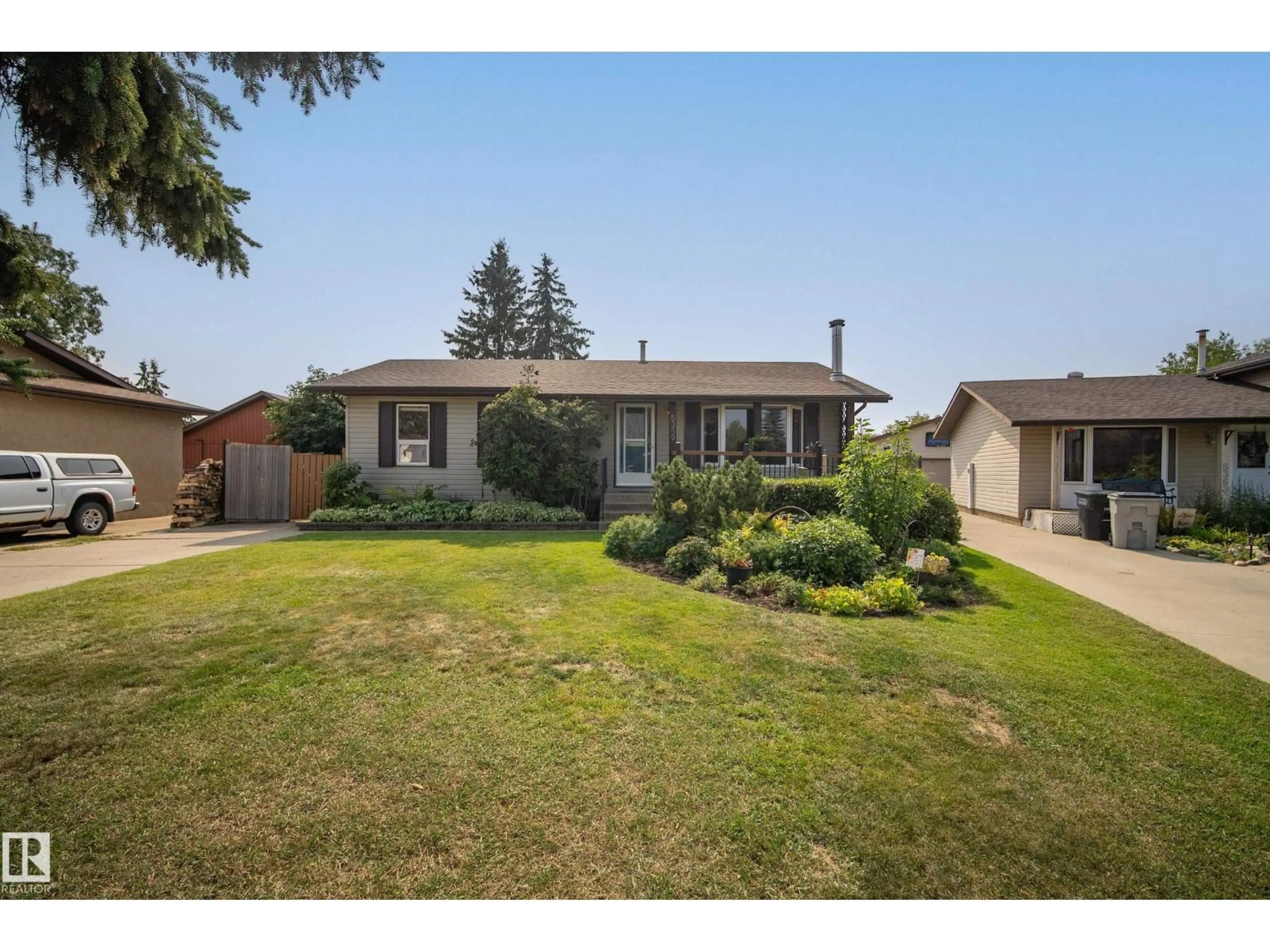 A pic from outside/outdoor area/front of a property/back of a property/a pic from drone, street for 5359 50 AV, Bon Accord Alberta T0A0K0