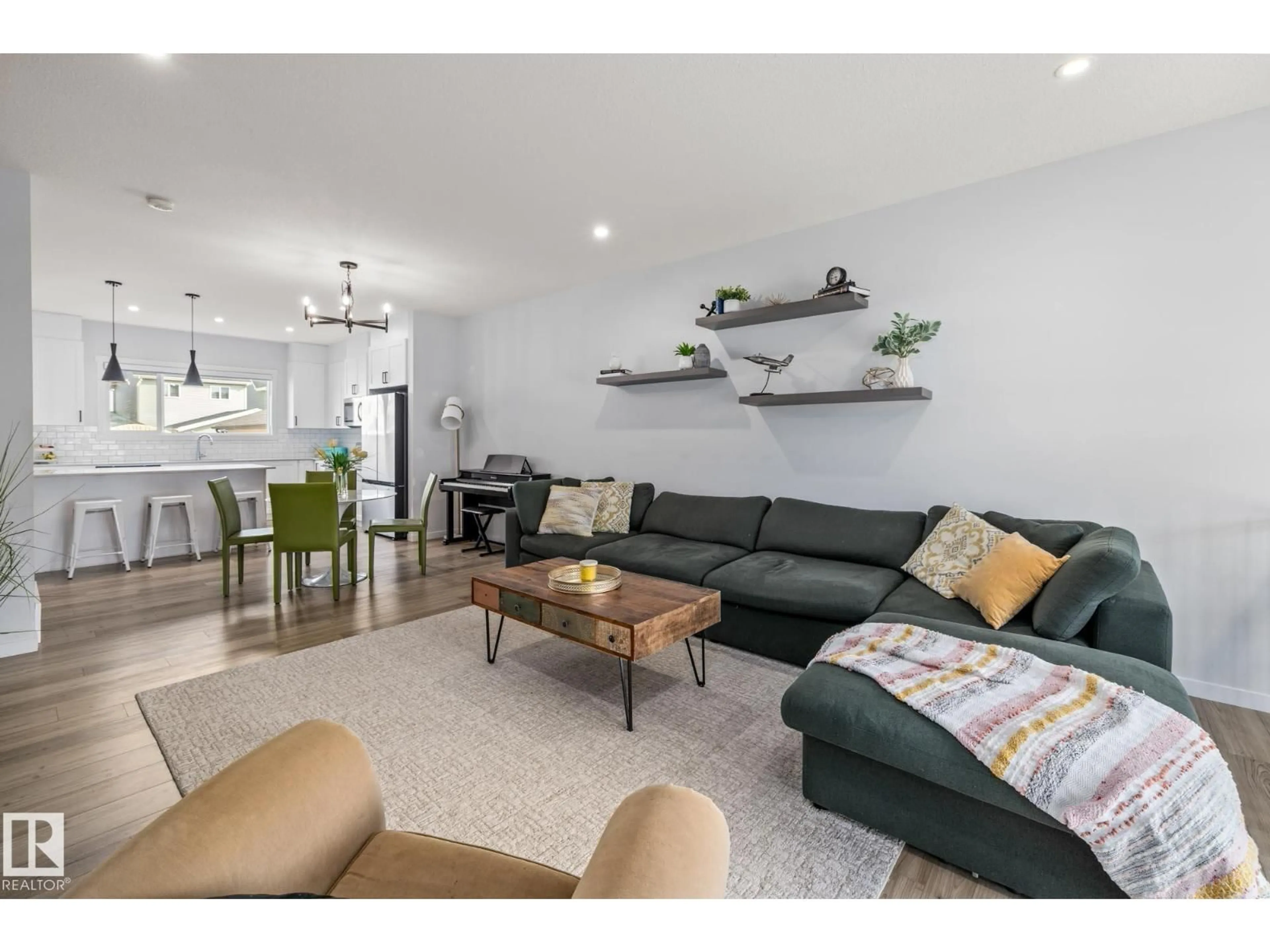 Living room with furniture, wood/laminate floor for 31 DORAIS WY, Fort Saskatchewan Alberta T8L0X3