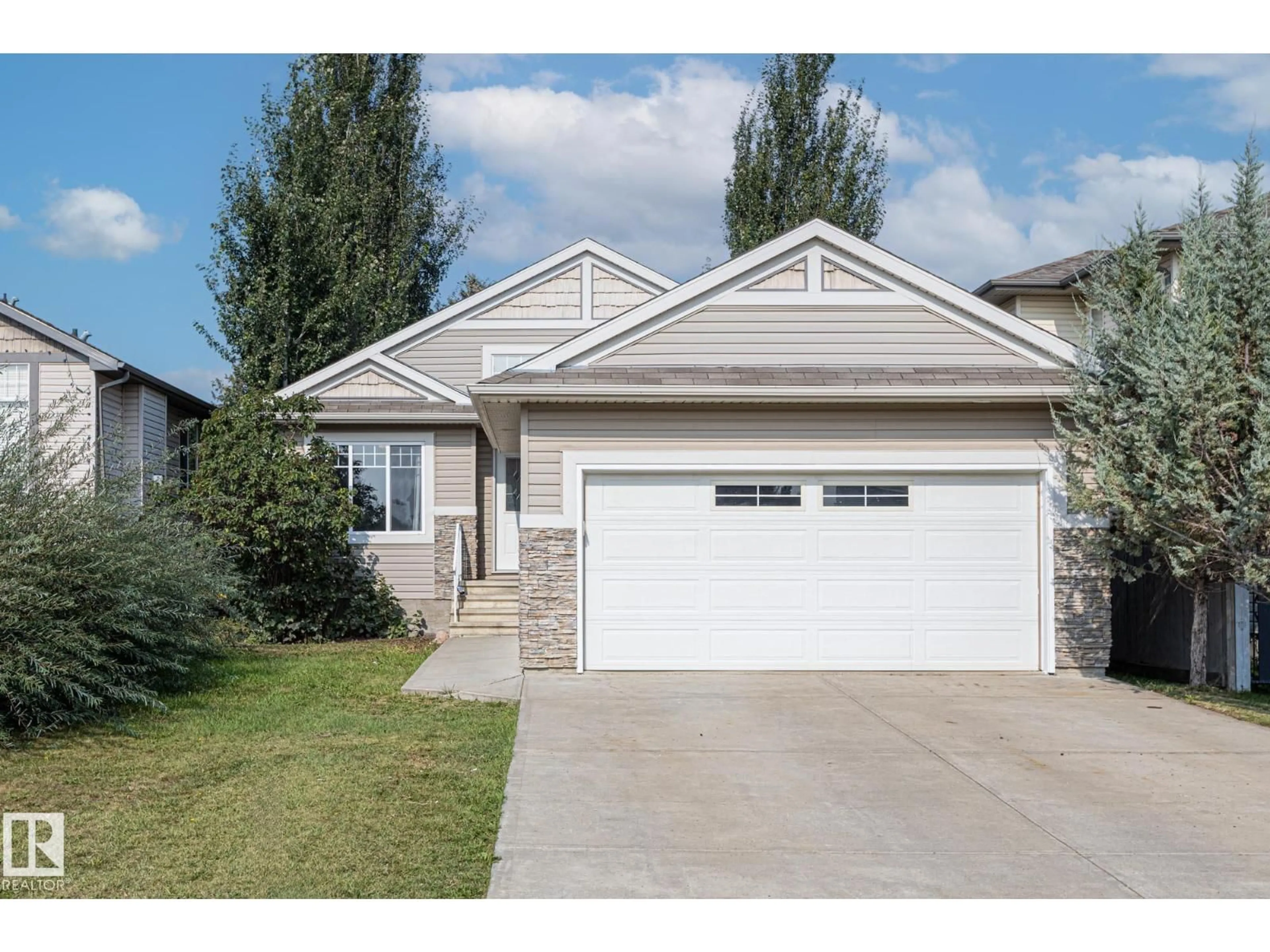 Home with vinyl exterior material, street for 8912 98 AV, Morinville Alberta T8R1T8