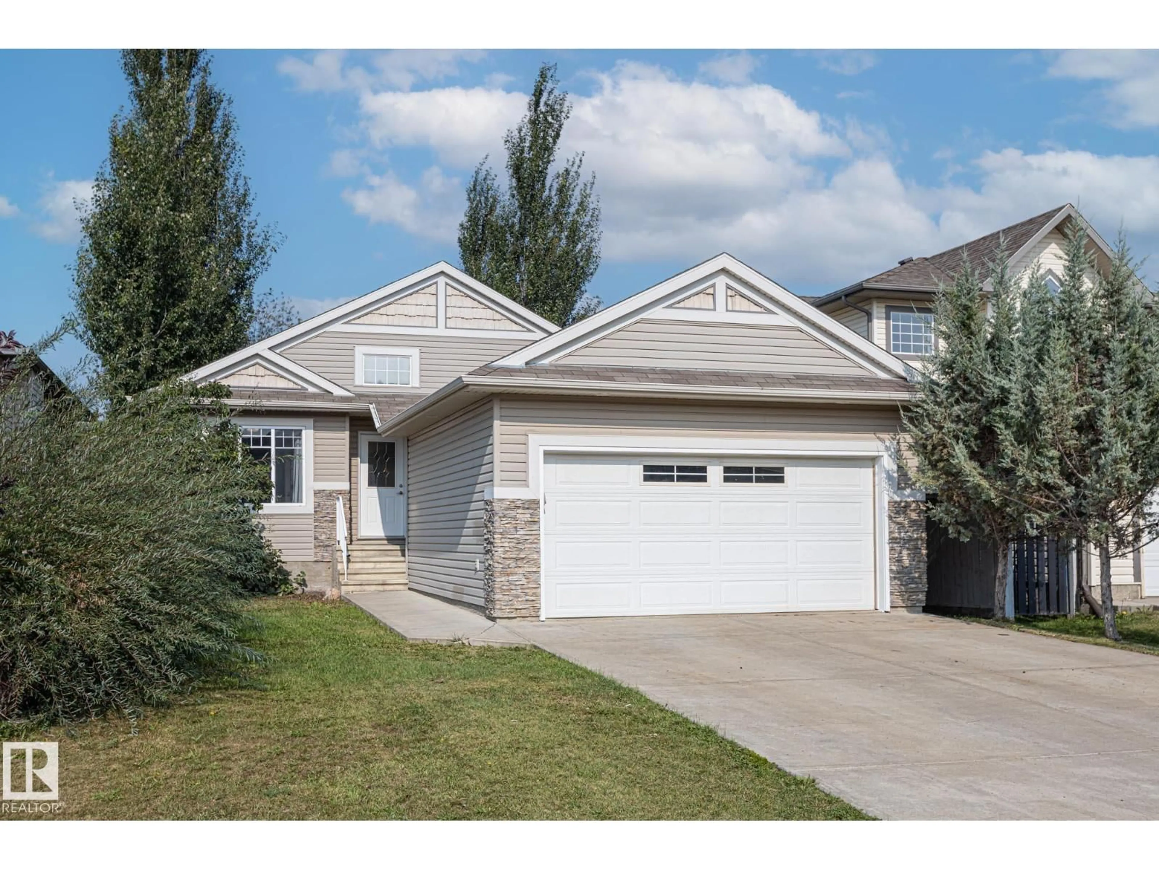 Home with vinyl exterior material, street for 8912 98 AV, Morinville Alberta T8R1T8