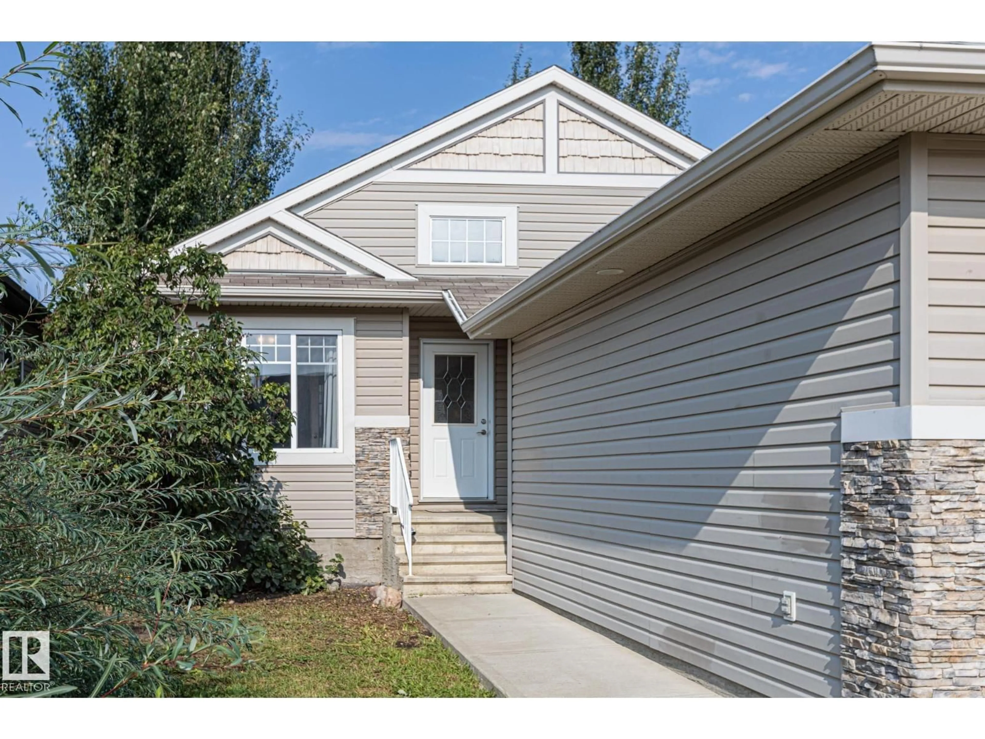 Home with vinyl exterior material, street for 8912 98 AV, Morinville Alberta T8R1T8