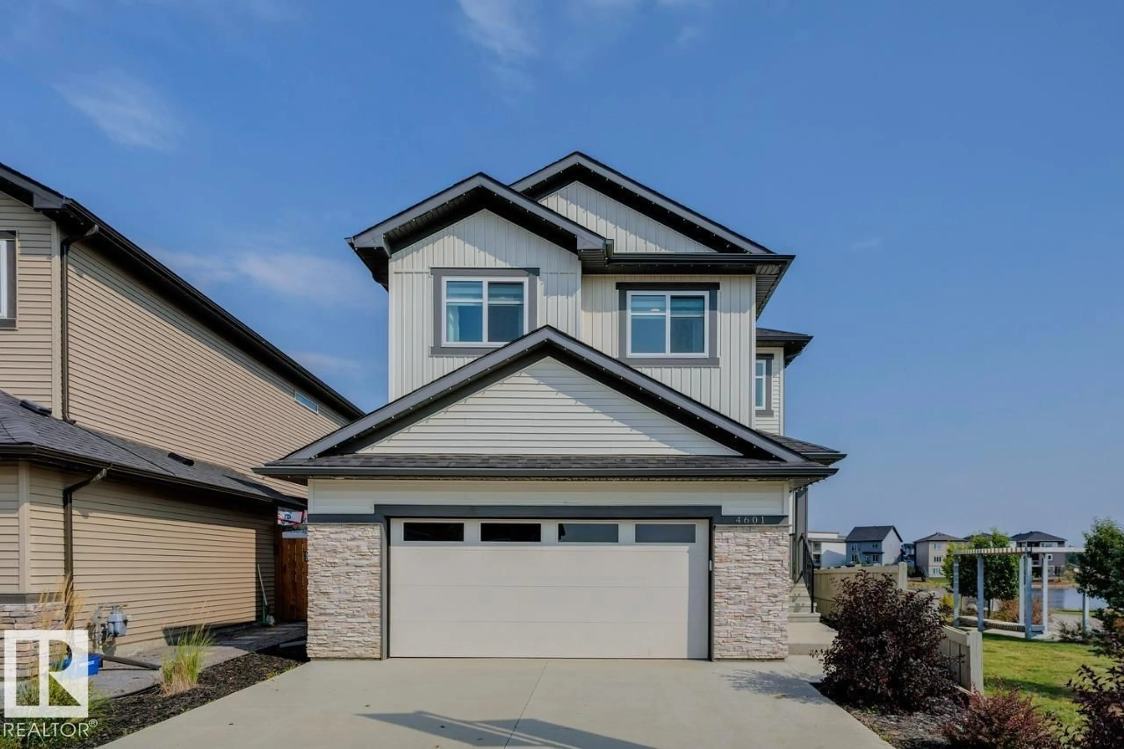 Home with vinyl exterior material, street for 4601 - 4601 66 ST, Beaumont Alberta T4X2X5