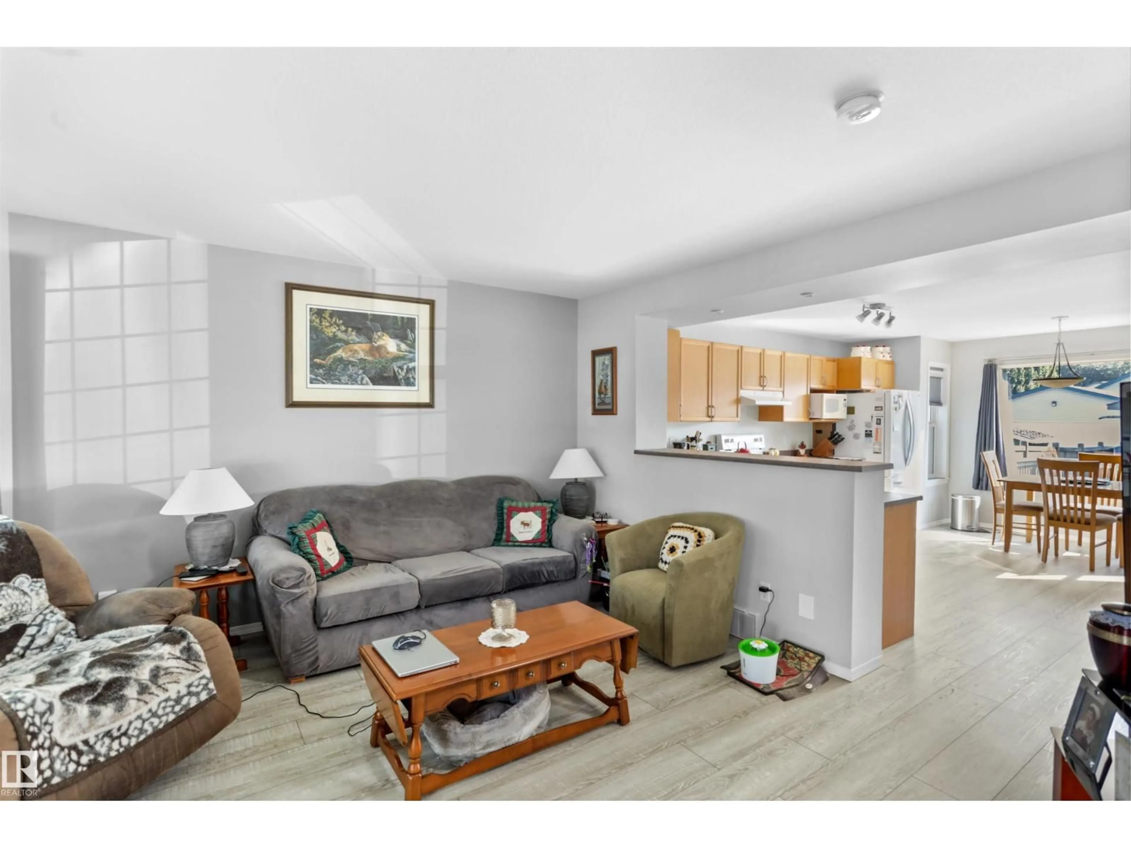 Living room with furniture, wood/laminate floor for 80 BIRCHWOOD DR, Devon Alberta T9G2J1