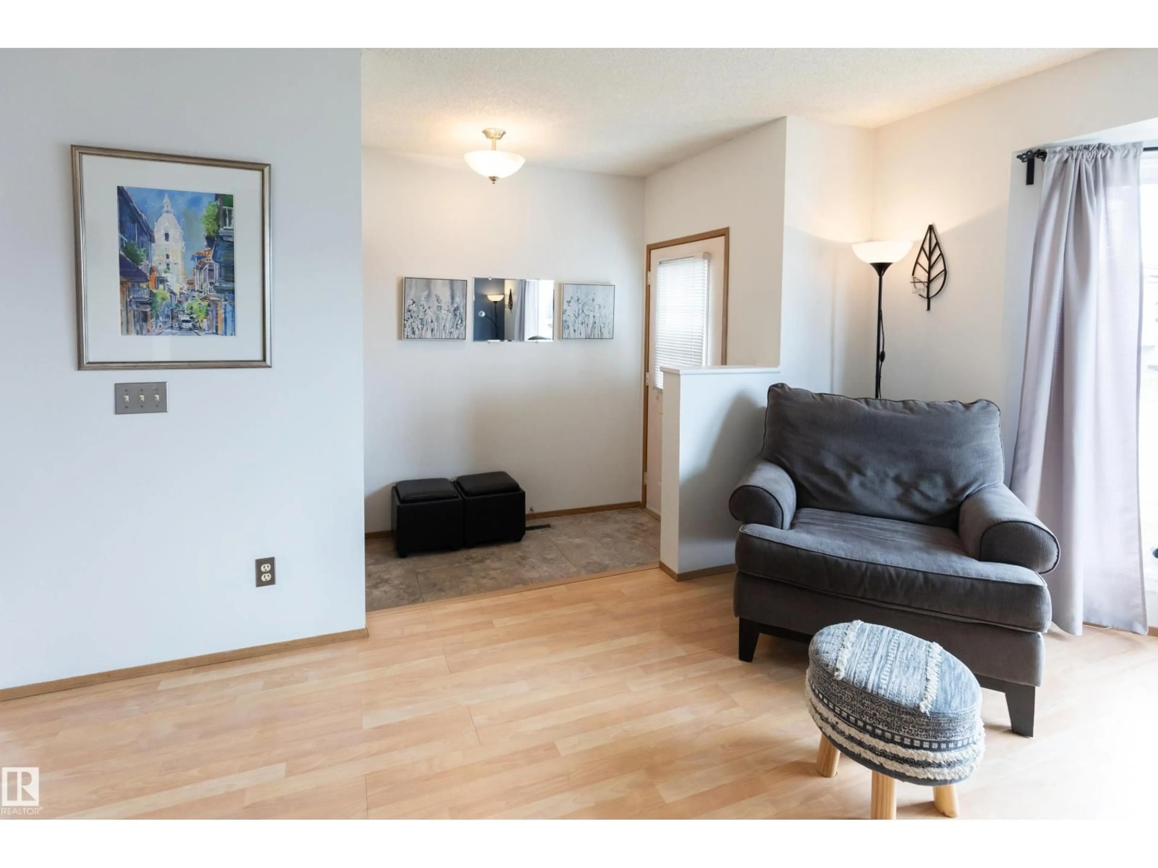 Living room with furniture, wood/laminate floor for 224 KIRKWOOD AV, Edmonton Alberta T6L5A8