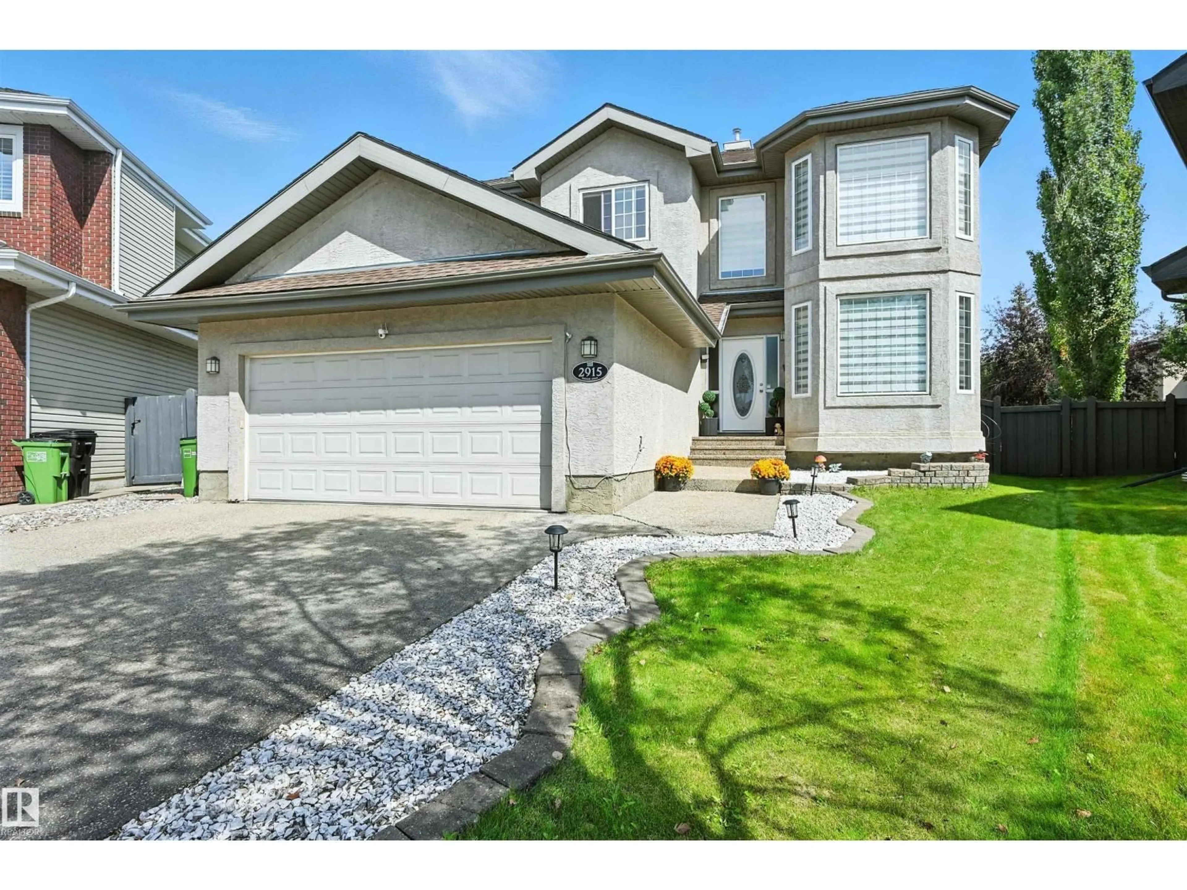 Home with vinyl exterior material, street for 2915 TREDGER GR, Edmonton Alberta T6R3R7