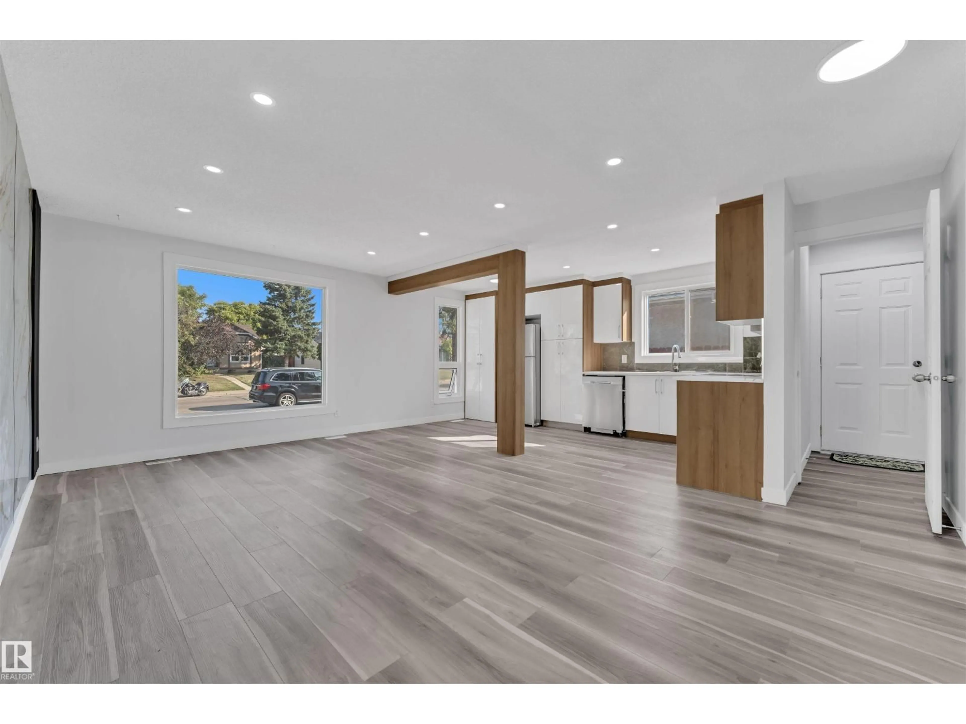 Open concept kitchen, wood/laminate floor for NW - 1758 37 ST, Edmonton Alberta T6L2R3