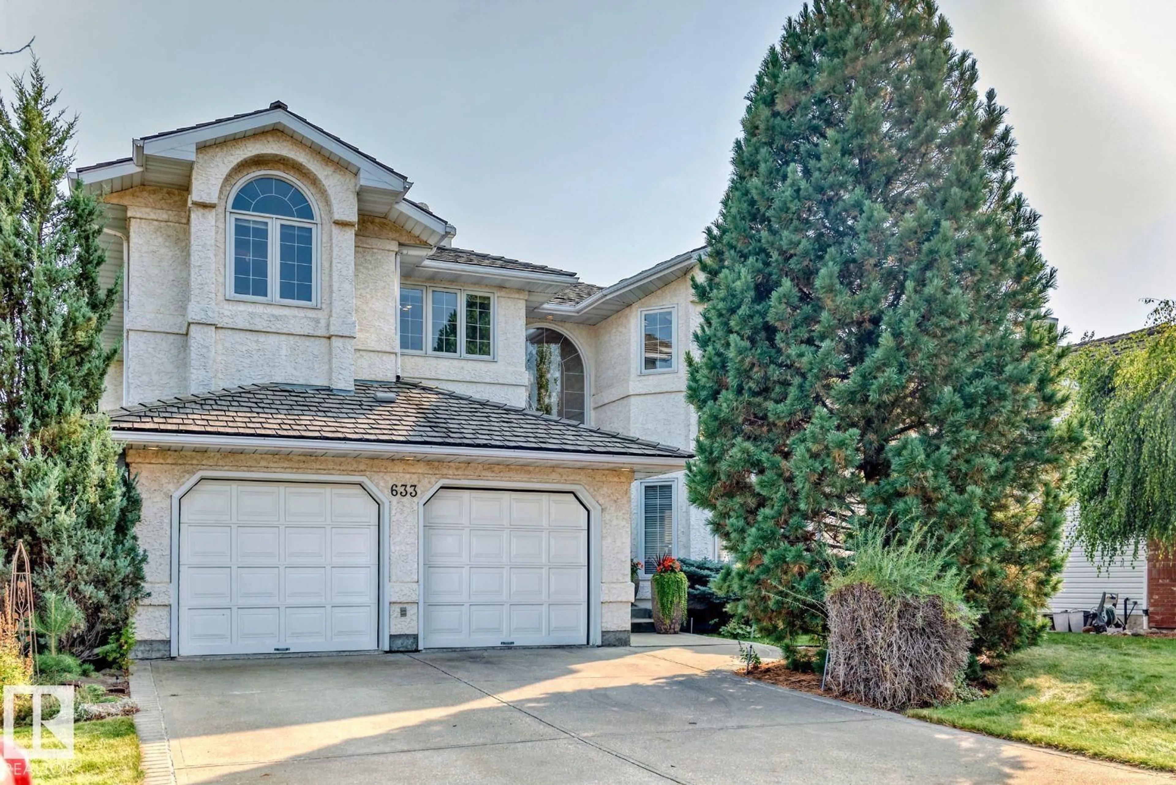 Home with vinyl exterior material, street for 633 BUTTERWORTH WD, Edmonton Alberta T6R2H8